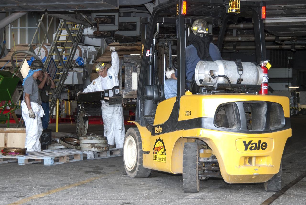 CAPE CANAVERAL, Fla. -- Technicians in the Vehicle Assembly Building at NASA’s Kennedy Space Center in Florida, are removing cover plates in preparation for replacing the roller bearing assemblies on crawler-transporter 2, or CT-2. The modifications are designed to ensure CT-2's ability to transport launch vehicles currently in development, such as the agency's Space Launch System which will send the Orion spacecraft carrying humans to new destinations in the solar system. The Ground Systems Development and Operations Program office at Kennedy is overseeing the upgrades to CT-2 so that it can carry NASA’s Space Launch System heavy-lift rocket and new Orion spacecraft to the launch pad. For more than 45 years the crawler-transporters were used to transport the mobile launcher platform and the Apollo-Saturn V rockets and, later, space shuttles to Launch Pads 39A and B. For more information, visit: http://www.nasa.gov/exploration/systems/ground/crawler-transporter_bearings.html Photo credit: NASA/Tim Jacobs