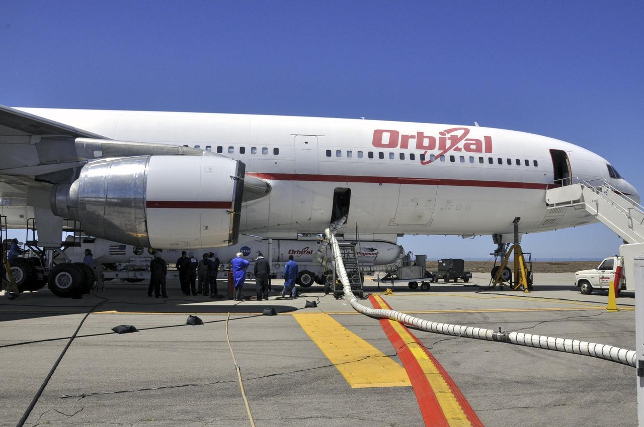 VANDENBERG AIR FORCE BASE, Calif. – Technicians and engineers at Vandenberg Air Force Base in California mate the Pegasus XL rocket with the Interface Region Imaging Spectrograph, or IRIS, solar observatory to the Orbital Sciences L-1011 carrier aircraft.      Scheduled for launch from Vandenberg on June 26, 2013, IRIS will open a new window of discovery by tracing the flow of energy and plasma through the chromospheres and transition region into the sun’s corona using spectrometry and imaging. The IRIS mission will observe how solar material moves, gathers energy and heats up as it travels through a largely unexplored region of the solar atmosphere. The interface region, located between the sun's visible surface and upper atmosphere, is where most of the sun's ultraviolet emission is generated. These emissions impact the near-Earth space environment and Earth's climate.   For more information, visit http://www.nasa.gov/iris Photo credit: NASA/Randy Beaudoin