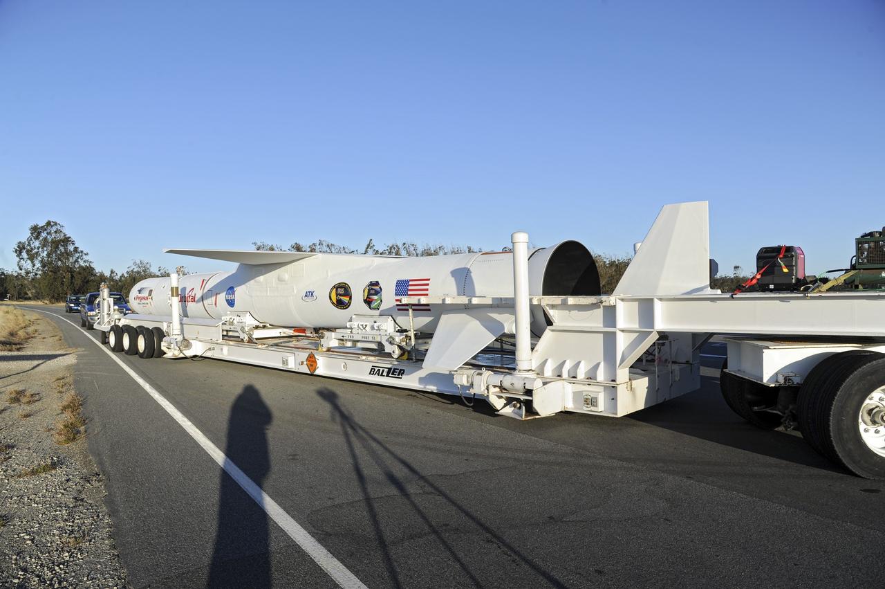 VANDENBERG AIR FORCE BASE, Calif. – At Vandenberg Air Force Base in California, the Pegasus XL rocket with the attached Interface Region Imaging Spectrograph IRIS solar observatory rolled out of the hangar on its transporter to the runway at Vandenberg. There, the rocket and spacecraft were mated with the Orbital Sciences L-1011 carrier aircraft.      Scheduled for launch from Vandenberg on June 26, 2013, IRIS will open a new window of discovery by tracing the flow of energy and plasma through the chromospheres and transition region into the sun’s corona using spectrometry and imaging. The IRIS mission will observe how solar material moves, gathers energy and heats up as it travels through a largely unexplored region of the solar atmosphere. The interface region, located between the sun's visible surface and upper atmosphere, is where most of the sun's ultraviolet emission is generated. These emissions impact the near-Earth space environment and Earth's climate.   For more information, visit http://www.nasa.gov/iris Photo credit: NASA/Randy Beaudoin