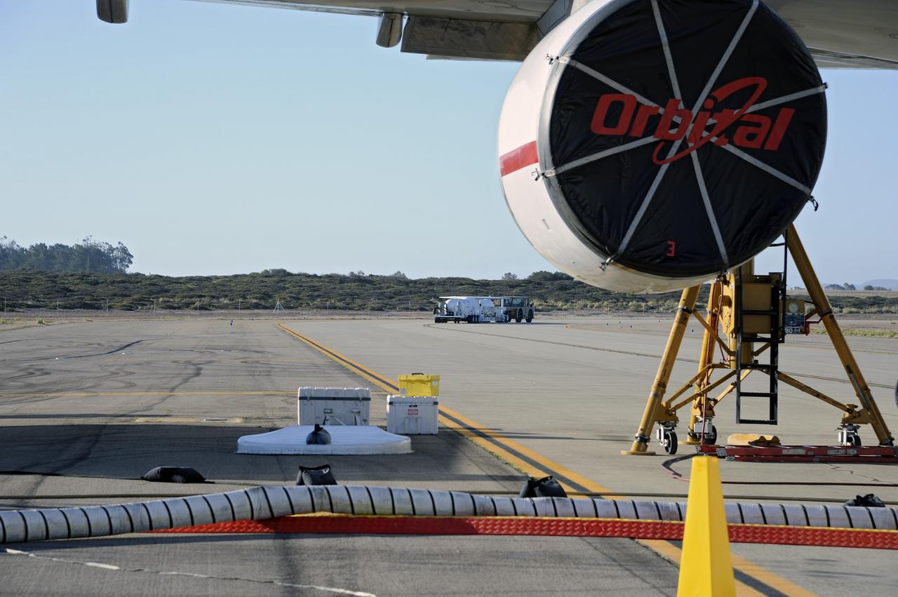 VANDENBERG AIR FORCE BASE, Calif. – At Vandenberg Air Force Base in California, the Pegasus XL rocket with the attached Interface Region Imaging Spectrograph IRIS solar observatory rolled out of the hangar on its transporter to the runway at Vandenberg. There, the rocket and spacecraft were mated with the Orbital Sciences L-1011 carrier aircraft.      Scheduled for launch from Vandenberg on June 26, 2013, IRIS will open a new window of discovery by tracing the flow of energy and plasma through the chromospheres and transition region into the sun’s corona using spectrometry and imaging. The IRIS mission will observe how solar material moves, gathers energy and heats up as it travels through a largely unexplored region of the solar atmosphere. The interface region, located between the sun's visible surface and upper atmosphere, is where most of the sun's ultraviolet emission is generated. These emissions impact the near-Earth space environment and Earth's climate.   For more information, visit http://www.nasa.gov/iris Photo credit: NASA/Randy Beaudoin
