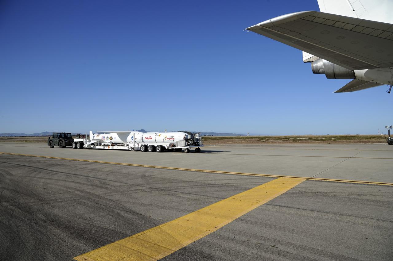 VANDENBERG AIR FORCE BASE, Calif. – At Vandenberg Air Force Base in California, the Pegasus XL rocket with the attached Interface Region Imaging Spectrograph IRIS solar observatory rolled out of the hangar on its transporter to the runway at Vandenberg. There, the rocket and spacecraft were mated with the Orbital Sciences L-1011 carrier aircraft.      Scheduled for launch from Vandenberg on June 26, 2013, IRIS will open a new window of discovery by tracing the flow of energy and plasma through the chromospheres and transition region into the sun’s corona using spectrometry and imaging. The IRIS mission will observe how solar material moves, gathers energy and heats up as it travels through a largely unexplored region of the solar atmosphere. The interface region, located between the sun's visible surface and upper atmosphere, is where most of the sun's ultraviolet emission is generated. These emissions impact the near-Earth space environment and Earth's climate.   For more information, visit http://www.nasa.gov/iris Photo credit: NASA/Randy Beaudoin