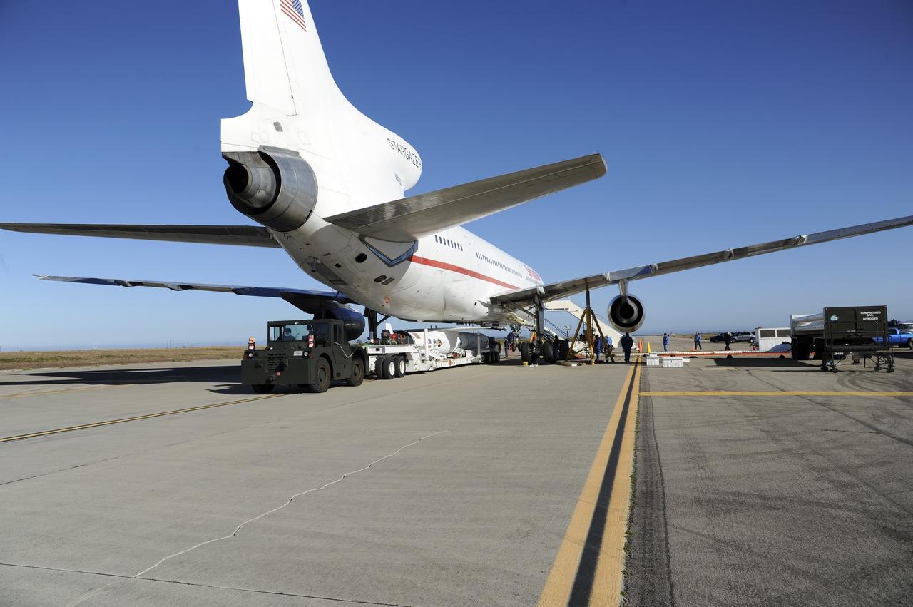 VANDENBERG AIR FORCE BASE, Calif. – At Vandenberg Air Force Base in California, the Pegasus XL rocket with the attached Interface Region Imaging Spectrograph IRIS solar observatory rolled out of the hangar on its transporter to the runway at Vandenberg. There, the rocket and spacecraft were mated with the Orbital Sciences L-1011 carrier aircraft.      Scheduled for launch from Vandenberg on June 26, 2013, IRIS will open a new window of discovery by tracing the flow of energy and plasma through the chromospheres and transition region into the sun’s corona using spectrometry and imaging. The IRIS mission will observe how solar material moves, gathers energy and heats up as it travels through a largely unexplored region of the solar atmosphere. The interface region, located between the sun's visible surface and upper atmosphere, is where most of the sun's ultraviolet emission is generated. These emissions impact the near-Earth space environment and Earth's climate.   For more information, visit http://www.nasa.gov/iris Photo credit: NASA/Randy Beaudoin