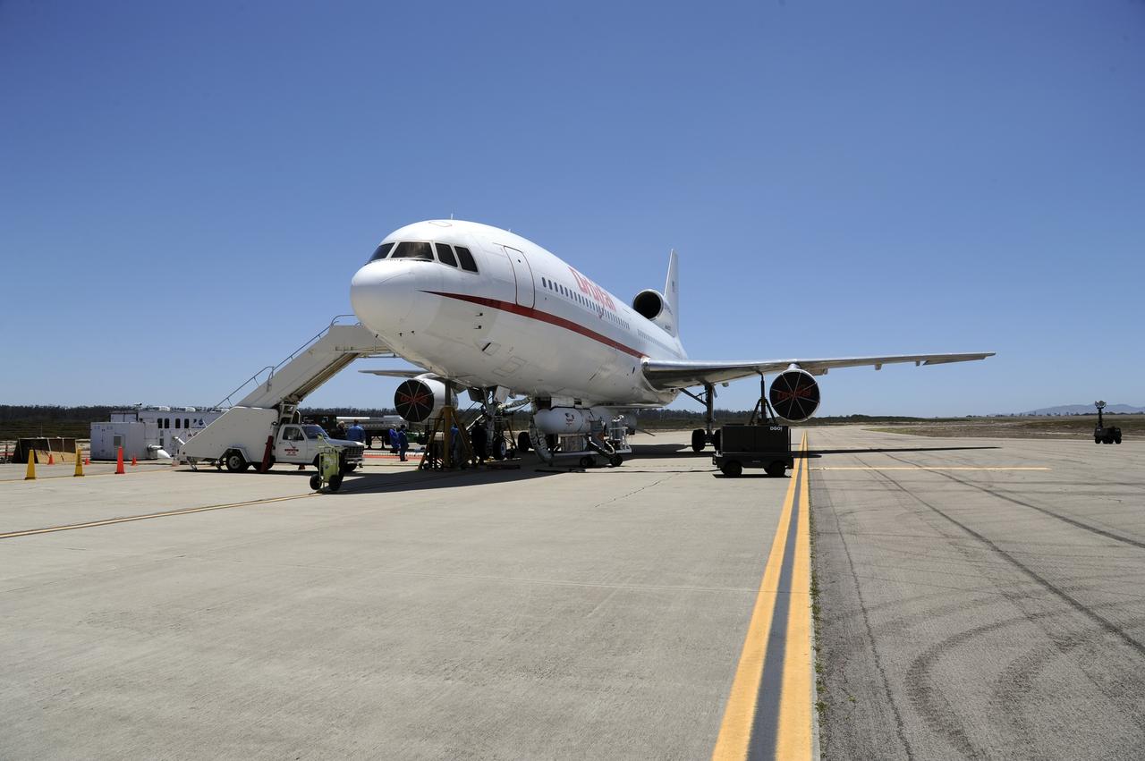 VANDENBERG AIR FORCE BASE, Calif. – At Vandenberg Air Force Base in California, the Pegasus XL rocket with the attached Interface Region Imaging Spectrograph IRIS solar observatory rolled out of the hangar on its transporter to the runway at Vandenberg. There, the rocket and spacecraft were mated with the Orbital Sciences L-1011 carrier aircraft.      Scheduled for launch from Vandenberg on June 26, 2013, IRIS will open a new window of discovery by tracing the flow of energy and plasma through the chromospheres and transition region into the sun’s corona using spectrometry and imaging. The IRIS mission will observe how solar material moves, gathers energy and heats up as it travels through a largely unexplored region of the solar atmosphere. The interface region, located between the sun's visible surface and upper atmosphere, is where most of the sun's ultraviolet emission is generated. These emissions impact the near-Earth space environment and Earth's climate.   For more information, visit http://www.nasa.gov/iris Photo credit: NASA/Randy Beaudoin