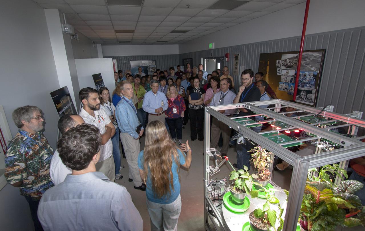 CAPE CANAVERAL, Fla. -- At the Kennedy Space Center in Florida, students from University of Colorado describe a robotic capability for growing a variety of plants, both for consumption as well as the benefit of oxygen-carbon dioxide cycling. Considerations range from monitoring and nutrient supply to selection of plants and autonomy. The activity is part of the eXploration Habitat, or X-Hab, Academic Innovation Challenge.      X-Hab Academic Innovation Challenge is a university-level activity designed to engage and retain students in Science, Technology, Engineering and Math, or STEM, disciplines. NASA will directly benefit from the effort by sponsoring the development of innovative habitat concepts from universities which may result in innovative ideas and solutions that could be applied to exploration habitats. For more: http://www.nasa.gov/exploration/technology/deep_space_habitat/xhab/ Photo credit: NASA/Jim Grossmann
