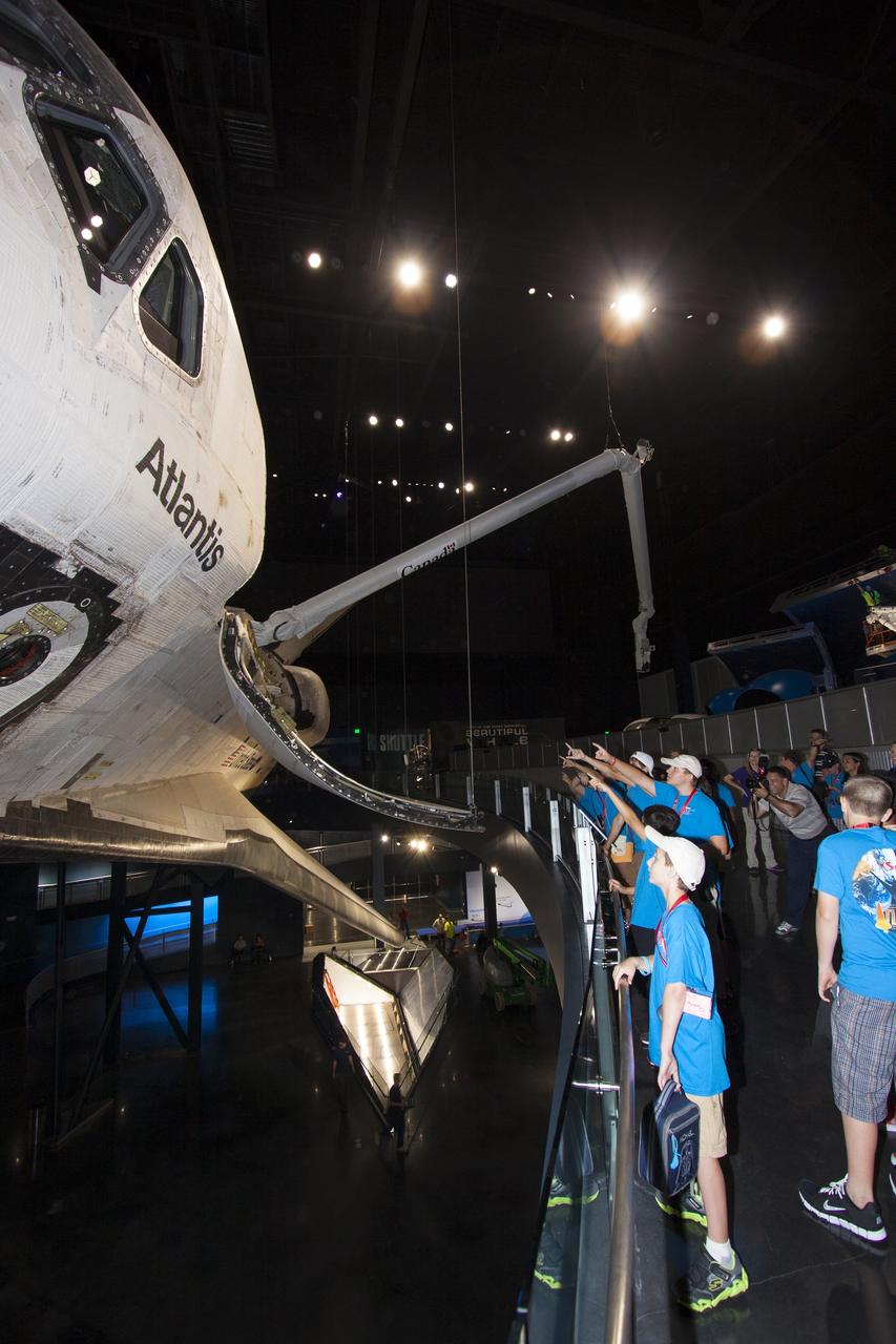 CAPE CANAVERAL, Fla. -- At the Kennedy Space Center Visitor Complex in Florida, Camp Kennedy Space Center participants get an up-close look at the space shuttle Atlantis during a weeklong summer activity for students entering second through ninth grades. Their tour took place just as final preparations were underway for the opening of the "Space Shuttle Atlantis" facility. The new $100 million facility will include interactive exhibits that tell the story of the 30-year Space Shuttle Program and highlight the future of space exploration. The "Space Shuttle Atlantis" exhibit is scheduled to open June 29, 2013.Photo credit: NASA/ Jim Grossmann