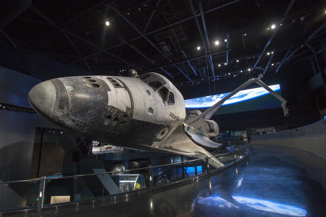 CAPE CANAVERAL, Fla. -- At the Kennedy Space Center Visitor Complex in Florida, construction crews are completing final preparations for the opening of the "Space Shuttle Atlantis" facility. The spacecraft will be the centerpiece of a 90,000-square-foot building in which visitors will see Atlantis as it appeared in space. The payload bay doors are opened and the shuttle's Canadarm remote manipulator system -- its robotic arm -- installed and extended. The new $100 million facility will include interactive exhibits that tell the story of the 30-year Space Shuttle Program and highlight the future of space exploration. The "Space Shuttle Atlantis" exhibit is scheduled to open June 29, 2013.Photo credit: NASA/ Jim Grossmann