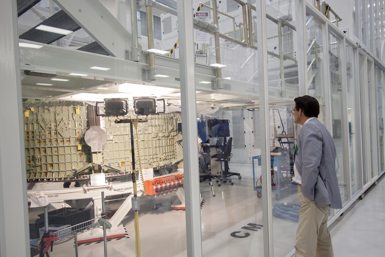 CAPE CANAVERAL, Fla. – Representatives from the European Space Agency, or ESA, including Nico Dettman, ESA Space Transportation Department director, toured the Operations and Checkout Building high bay and viewed the Orion crew module at NASA’s Kennedy Space Center in Florida.     Orion is the exploration spacecraft designed to carry crews to space beyond low Earth orbit. It will provide emergency abort capability, sustain the crew during the space travel and provide safe re-entry from deep space return velocities. Orion’s first unpiloted test flight is scheduled to launch in 2014 atop a Delta IV rocket. A second uncrewed flight test is scheduled for 2017 on NASA’s Space Launch System rocket. For more information, visit http://www.nasa.gov/orion. Photo credit: NASA/Jim Grossmann