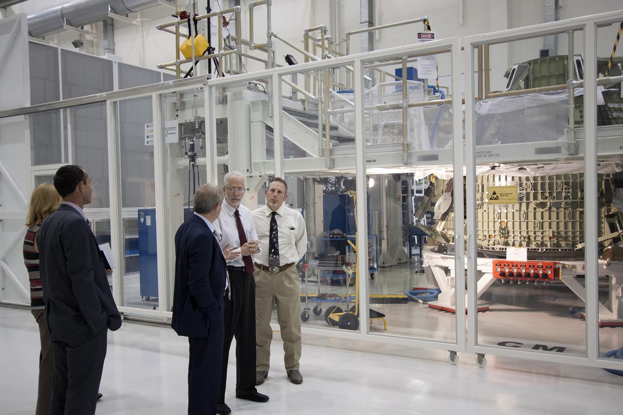 CAPE CANAVERAL, Fla. – Representatives from the European Space Agency, or ESA, toured the Operations and Checkout Building high bay and viewed the Orion crew module at NASA’s Kennedy Space Center in Florida. From the left, are Philippe Deloo, ESA European Service Module Study manager Kathleen Schubert, NASA crew and service module deputy manager Bernardo Patti, ESA manager of International Space Station Operations Mark Geyer, NASA Orion program manager and Ari Blum, NASA export administrator at Johnson Space Center in Houston.     Orion is the exploration spacecraft designed to carry crews to space beyond low Earth orbit. It will provide emergency abort capability, sustain the crew during the space travel and provide safe re-entry from deep space return velocities. Orion’s first unpiloted test flight is scheduled to launch in 2014 atop a Delta IV rocket. A second uncrewed flight test is scheduled for 2017 on NASA’s Space Launch System rocket. For more information, visit http://www.nasa.gov/orion. Photo credit: NASA/Jim Grossmann