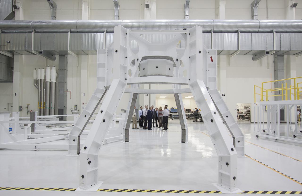 CAPE CANAVERAL, Fla. – Representatives from the European Space Agency, or ESA, toured the Operations and Checkout Building high bay and viewed the Orion crew module at NASA’s Kennedy Space Center in Florida. Among the group were Nico Dettman, ESA Space Transportation Department director Bernardo Patti, ESA International Space Station Operations manager and Philippe Deloo, ESA European Service Module Study manager.     Orion is the exploration spacecraft designed to carry crews to space beyond low Earth orbit. It will provide emergency abort capability, sustain the crew during the space travel and provide safe re-entry from deep space return velocities. Orion’s first unpiloted test flight is scheduled to launch in 2014 atop a Delta IV rocket. A second uncrewed flight test is scheduled for 2017 on NASA’s Space Launch System rocket. For more information, visit http://www.nasa.gov/orion. Photo credit: NASA/Jim Grossmann