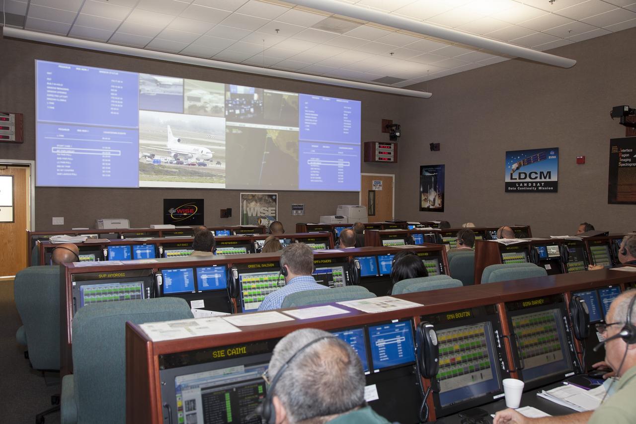 VANDENBERG AIR FORCE BASE, Calif. – At Vandenberg Air Force Base in California, mission managers participate in a pre-launch dress rehearsal in the Launch Vehicle Data Center for NASA’s Interface Region Imaging Spectrograph, or IRIS, solar observatory.    Scheduled for launch from Vandenberg on June 26 aboard an Orbital Sciences Pegasus XL rocket, IRIS will open a new window of discovery by tracing the flow of energy and plasma through the chromospheres and transition region in to the sun’s corona using spectrometry and imaging. The IRIS mission will observe how solar material moves, gathers energy and heats up as it travels through a largely unexplored region of the solar atmosphere. The interface region, located between the sun’s visible surface and upper atmosphere, is where most of the sun’s ultraviolet emission is generated. These emissions impact the near-Earth space environment and Earth’s climate. For more information, visit http://www.nasa.gov/iris.  Photo credit: NASA/Daniel Casper