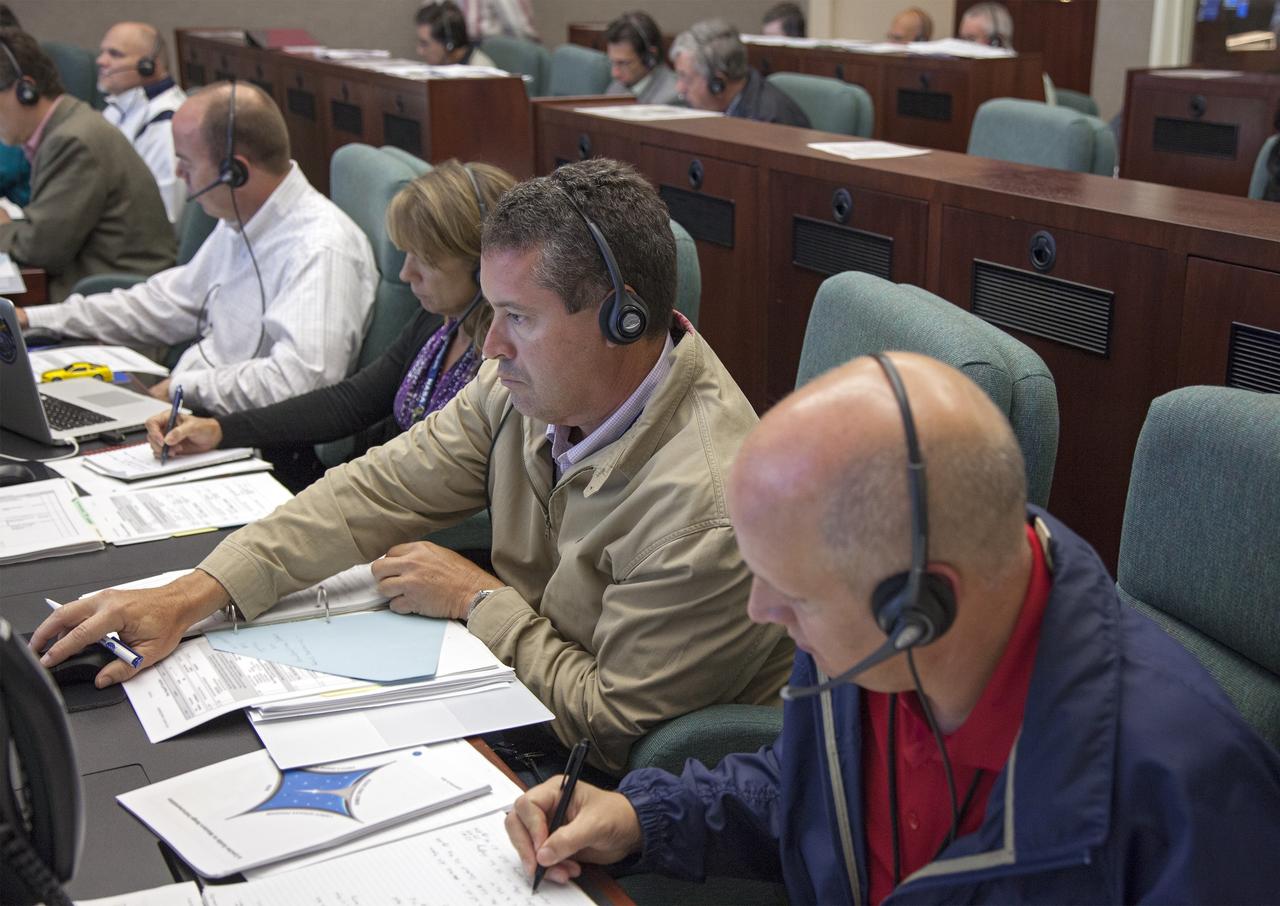 VANDENBERG AIR FORCE BASE, Calif. – At Vandenberg Air Force Base in California, mission managers participate in a pre-launch dress rehearsal in the Launch Vehicle Data Center for NASA’s Interface Region Imaging Spectrograph, or IRIS, solar observatory.    Scheduled for launch from Vandenberg on June 26 aboard an Orbital Sciences Pegasus XL rocket, IRIS will open a new window of discovery by tracing the flow of energy and plasma through the chromospheres and transition region in to the sun’s corona using spectrometry and imaging. The IRIS mission will observe how solar material moves, gathers energy and heats up as it travels through a largely unexplored region of the solar atmosphere. The interface region, located between the sun’s visible surface and upper atmosphere, is where most of the sun’s ultraviolet emission is generated. These emissions impact the near-Earth space environment and Earth’s climate. For more information, visit http://www.nasa.gov/iris.  Photo credit: NASA/Daniel Casper