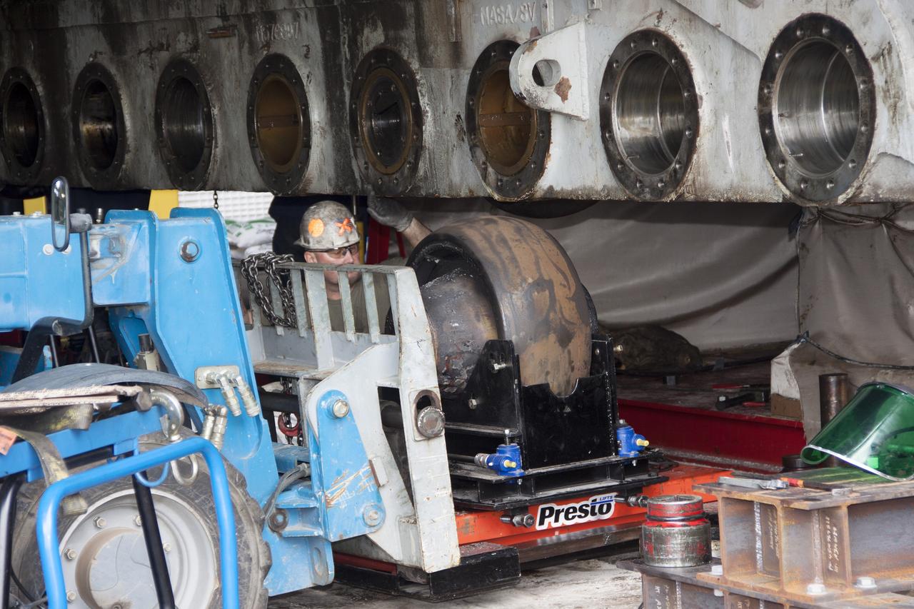 CAPE CANAVERAL, Fla. – Inside the Vehicle Assembly Building at NASA’s Kennedy Space Center in Florida, preparations are underway to install new roller shaft bearings in crawler-transporter 2, or CT-2.      Work continues in high bay 2 to upgrade CT-2. The modifications are designed to ensure CT-2’s ability to transport launch vehicles currently in development, such as the agency’s Space Launch System, to the launch pad. The Ground Systems Development and Operations Program office at Kennedy is overseeing the upgrades. For more than 45 years the crawler-transporters were used to transport the mobile launcher platform and the Apollo-Saturn V rockets and, later, space shuttles to Launch Pads 39A and B. For more information, visit: http://www.nasa.gov/exploration/systems/ground/crawler-transporter_bearings.html. Photo credit: NASA/Jim Grossmann
