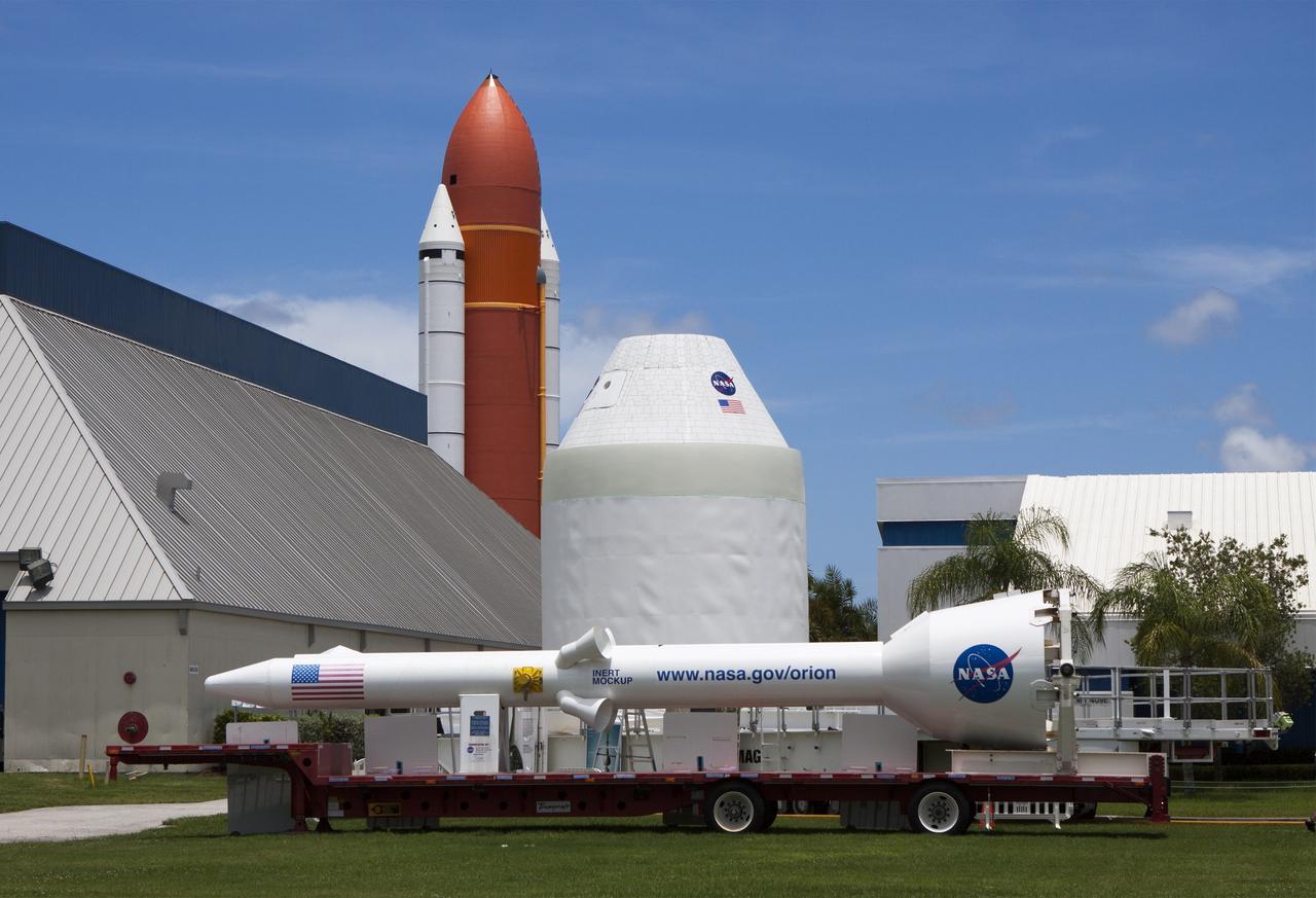 CAPE CANAVERAL, Fla. – At NASA’s Kennedy Space Center in Florida, a full-size mock-up of the Orion spacecraft and launch abort system were transported to the Kennedy Space Center Visitor Complex. In the background are full-size replicas of the external fuel tank and solid rocket boosters that mark the entranceway to the new Space Shuttle Atlantis exhibit. Crane operators and technicians practice de-stacking operations on mock-ups of Orion and the launch abort system in the Vehicle Assembly Building in order to keep processing procedures and skills current. Orion is the exploration spacecraft designed to carry crews to space beyond low Earth orbit. It will provide emergency abort capability, sustain the crew during the space travel and provide safe re-entry from deep space return velocities. Orion’s first unpiloted test flight is scheduled to launch in 2014 atop a Delta IV rocket. A second uncrewed flight test is scheduled for 2017 on NASA’s Space Launch System rocket. For more information, visit http://www.nasa.gov/orion. Photo credit: NASA/Jim Grossmann