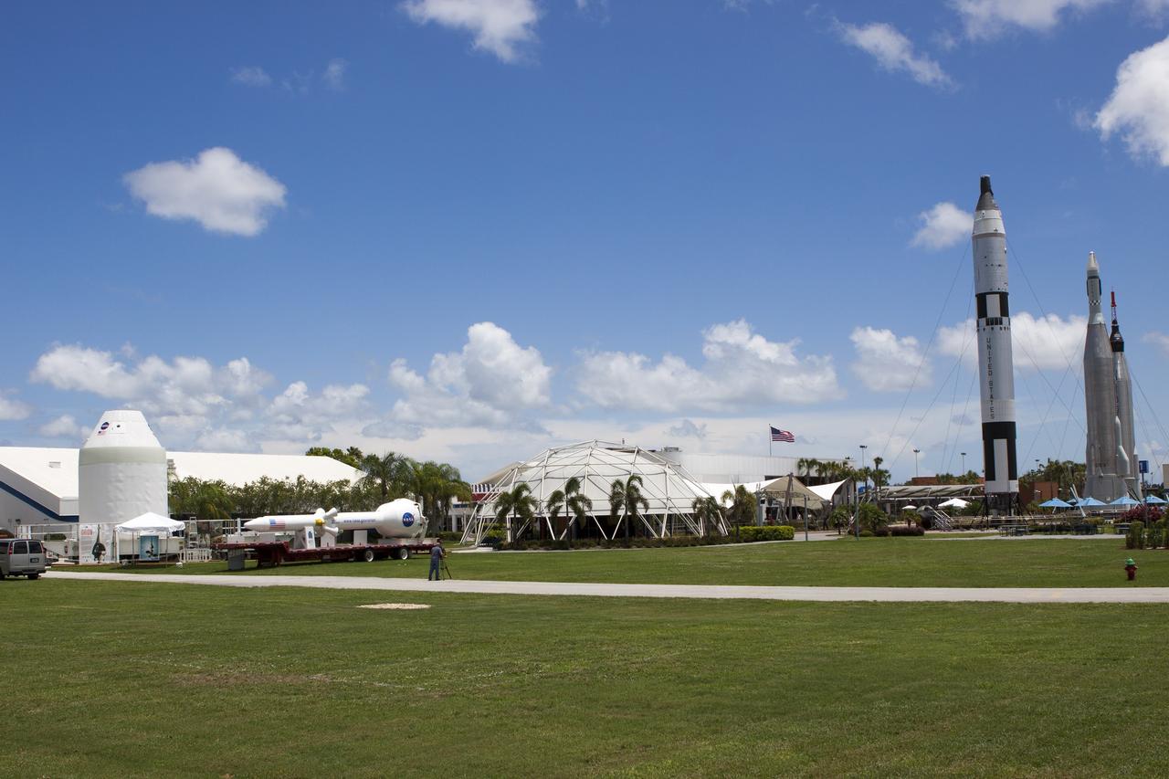 CAPE CANAVERAL, Fla. – At NASA’s Kennedy Space Center in Florida, a full-size mock-up of the Orion spacecraft and launch abort system, at left, are displayed at the Kennedy Space Center Visitor Complex. In the background, to the right, is the rocket garden. Crane operators and technicians practice de-stacking operations on mock-ups of Orion and the launch abort system in the Vehicle Assembly Building in order to keep processing procedures and skills current. Orion is the exploration spacecraft designed to carry crews to space beyond low Earth orbit. It will provide emergency abort capability, sustain the crew during the space travel and provide safe re-entry from deep space return velocities. Orion’s first unpiloted test flight is scheduled to launch in 2014 atop a Delta IV rocket. A second uncrewed flight test is scheduled for 2017 on NASA’s Space Launch System rocket. For more information, visit http://www.nasa.gov/orion. Photo credit: NASA/Jim Grossmann