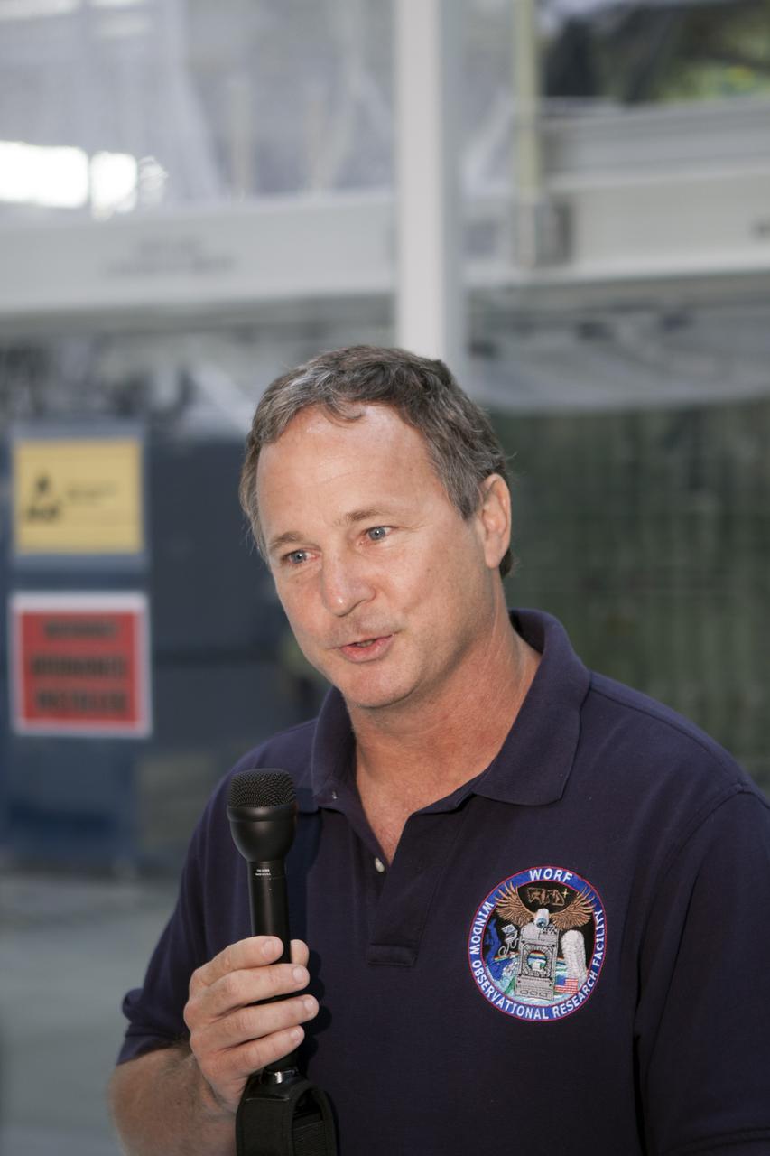 CAPE CANAVERAL, Fla. – Inside the Operations and Checkout Building high bay at NASA’s Kennedy Space Center in Florida, members of the media receive an on activities in NASA’s Ground Systems Development and Operations, or GSDO, Program, Space Launch System and Orion crew module for Exploration Test Flight 1.  Speaking to the media is Tom Erdman, from Marshall Space Flight Center’s Kennedy resident office.    Orion is the exploration spacecraft designed to carry crews to space beyond low Earth orbit. It will provide emergency abort capability, sustain the crew during the space travel and provide safe re-entry from deep space return velocities. Orion’s first unpiloted test flight is scheduled to launch in 2014 atop a Delta IV rocket. A second uncrewed flight test is scheduled for 2017 on NASA’s Space Launch System rocket. For more information, visit http://www.nasa.gov/orion. Photo credit: NASA/Jim Grossmann