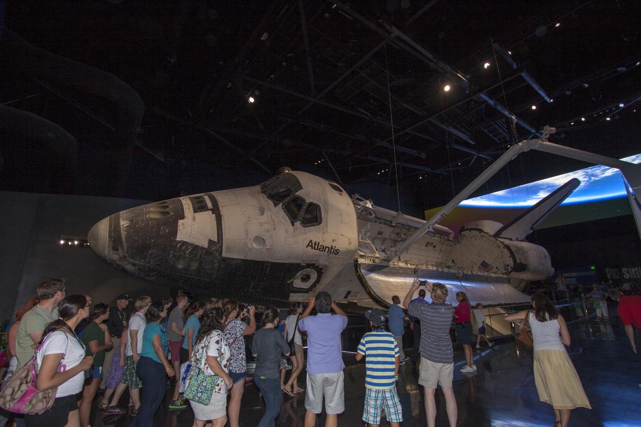 CAPE CANAVERAL, Fla. -- At the Kennedy Space Center Visitor Complex in Florida, guests participate in an early viewing of the Space Shuttle Atlantis and other exhibits inside the 90,000-square-foot facility. The new $100 million facility will include interactive exhibits that tell the story of the 30-year Space Shuttle Program and highlight the future of space exploration. The "Space Shuttle Atlantis" exhibit is scheduled to open June 29, 2013.Photo credit: NASA/Jim Grossmann