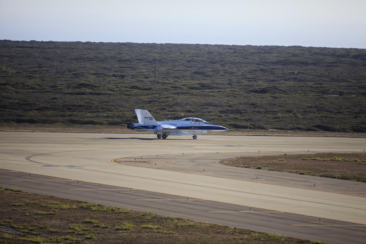 VANDENBERG AIR FORCE BASE, Calif. – An F-18 aircraft departs from Vandenberg Air Force Base in California. The plane will serve as the "chase plane" accompanying the Orbital Sciences L-1011 aircraft as it transports the Pegasus XL rocket carrying NASA's Interface Region Imaging Spectrograph, or IRIS, solar observatory over the Pacific Ocean. Release of the rocket from under the wing of the L-1011 is scheduled for 10:27 p.m. EDT. IRIS will open a new window of discovery using spectrometry and imaging to trace the flow of energy and plasma through the chromospheres and transition region into the sun’s corona. The spacecraft will observe how solar material moves, gathers energy and heats up as it travels through a largely unexplored region of the solar atmosphere. This interface region, located between the sun's visible surface and its upper atmosphere, is where most of its ultraviolet emission is generated. These emissions impact the near-Earth space environment and Earth's climate. NASA's Launch Services Program at the agency's Kennedy Space Center in Florida is managing the countdown and launch. For more information, visit http://www.nasa.gov/iris. Photo credit: NASA/Daniel Casper