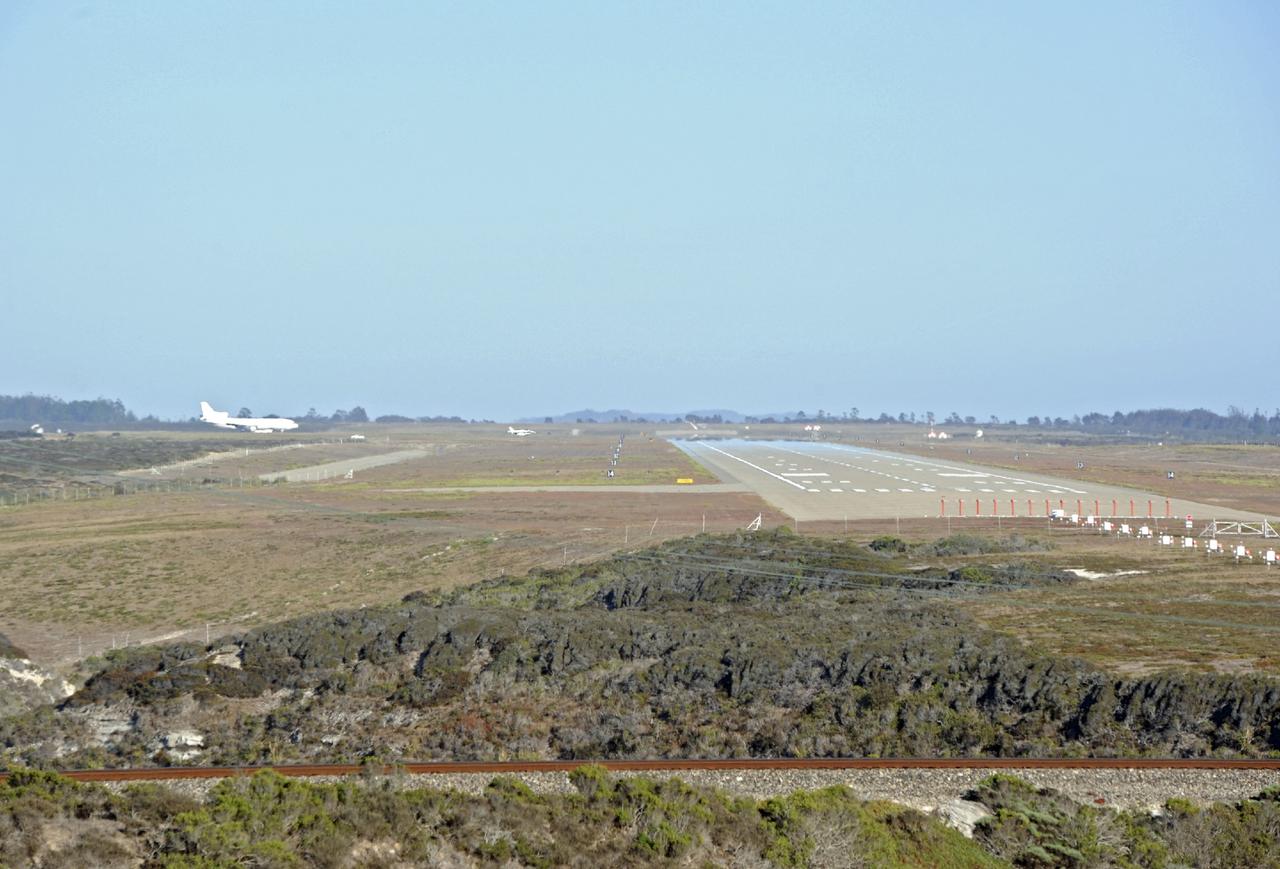 VANDENBERG AIR FORCE BASE, Calif. – A NASA F-18 and an Orbital Sciences L-1011 carrier aircraft taxi to the runway at Vandenberg Air Force Base, Calif., before taking off on a mission to launch NASA's IRIS spacecraft into low-Earth orbit. IRIS, short for Interface Region Imaging Spectrograph, was launched aboard an Orbital Sciences Pegasus XL rocket released from the L-1011. Photo credit: VAFB/ Chris Wiant