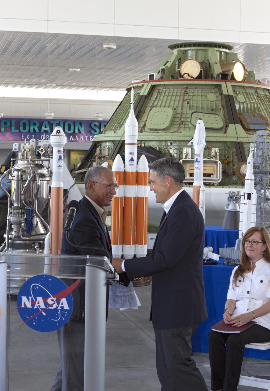 CAPE CANAVERAL, Fla. -- NASA Administrator Charles Bolden, left, welcomes Kennedy Space Center Director Robert Cabana to the podium following the announcement of a new agency partnership during a news conference at the Kennedy Space Center Visitor Complex in Florida. At right is Lisa Malone, director of Public Affairs at Kennedy. NASA has selected Space Florida, the aerospace economic development agency for the state of Florida, for negotiations toward a partnership agreement to maintain and operate the historic Shuttle Landing Facility, or SLF. NASA issued a request for information to industry in 2012 to identify new and innovative ways to use the facility for current and future commercial and government mission activities. Space Florida's proposal is aligned closely with Kennedy's vision for creating a multiuser spaceport. The SLF, specially designed for space shuttles returning to Kennedy, opened for flights in 1976. The concrete runway is 15,000 feet long and 300 feet wide. The SLF is capable of handling all types and sizes of aircraft and horizontal launch and landing vehicles. For more information on Space Florida, visit http://www.spaceflorida.gov. Photo credit: NASA/Jim Grossmann
