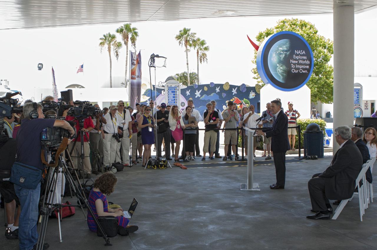 CAPE CANAVERAL, Fla. -- Kennedy Space Center Director Robert Cabana, at the podium, addresses the media assembled for a news conference on a new agency partnership at the Kennedy Space Center Visitor Complex in Florida. Also participating in the news conference are, seated from left, Space Florida Chief Operating Officer Jim Kuzma, NASA Administrator Charles Bolden, and Kennedy's Director of Public Affairs Lisa Malone. NASA has selected Space Florida, the aerospace economic development agency for the state of Florida, for negotiations toward a partnership agreement to maintain and operate the historic Shuttle Landing Facility, or SLF. NASA issued a request for information to industry in 2012 to identify new and innovative ways to use the facility for current and future commercial and government mission activities. Space Florida's proposal is aligned closely with Kennedy's vision for creating a multiuser spaceport. The SLF, specially designed for space shuttles returning to Kennedy, opened for flights in 1976. The concrete runway is 15,000 feet long and 300 feet wide. The SLF is capable of handling all types and sizes of aircraft and horizontal launch and landing vehicles. For more information on Space Florida, visit http://www.spaceflorida.gov. Photo credit: NASA/Jim Grossmann