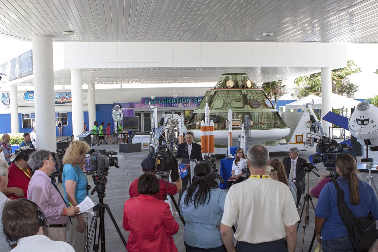 CAPE CANAVERAL, Fla. -- Kennedy Space Center Director Robert Cabana, at the podium, addresses the media assembled for a news conference on a new agency partnership at the Kennedy Space Center Visitor Complex in Florida. Also participating in the news conference are, seated from left, Kennedy's Director of Public Affairs Lisa Malone, NASA Administrator Charles Bolden, not in view, and Space Florida Chief Operating Officer Jim Kuzma. NASA has selected Space Florida, the aerospace economic development agency for the state of Florida, for negotiations toward a partnership agreement to maintain and operate the historic Shuttle Landing Facility, or SLF. NASA issued a request for information to industry in 2012 to identify new and innovative ways to use the facility for current and future commercial and government mission activities. Space Florida's proposal is aligned closely with Kennedy's vision for creating a multiuser spaceport. The SLF, specially designed for space shuttles returning to Kennedy, opened for flights in 1976. The concrete runway is 15,000 feet long and 300 feet wide. The SLF is capable of handling all types and sizes of aircraft and horizontal launch and landing vehicles. For more information on Space Florida, visit http://www.spaceflorida.gov. Photo credit: NASA/Jim Grossmann