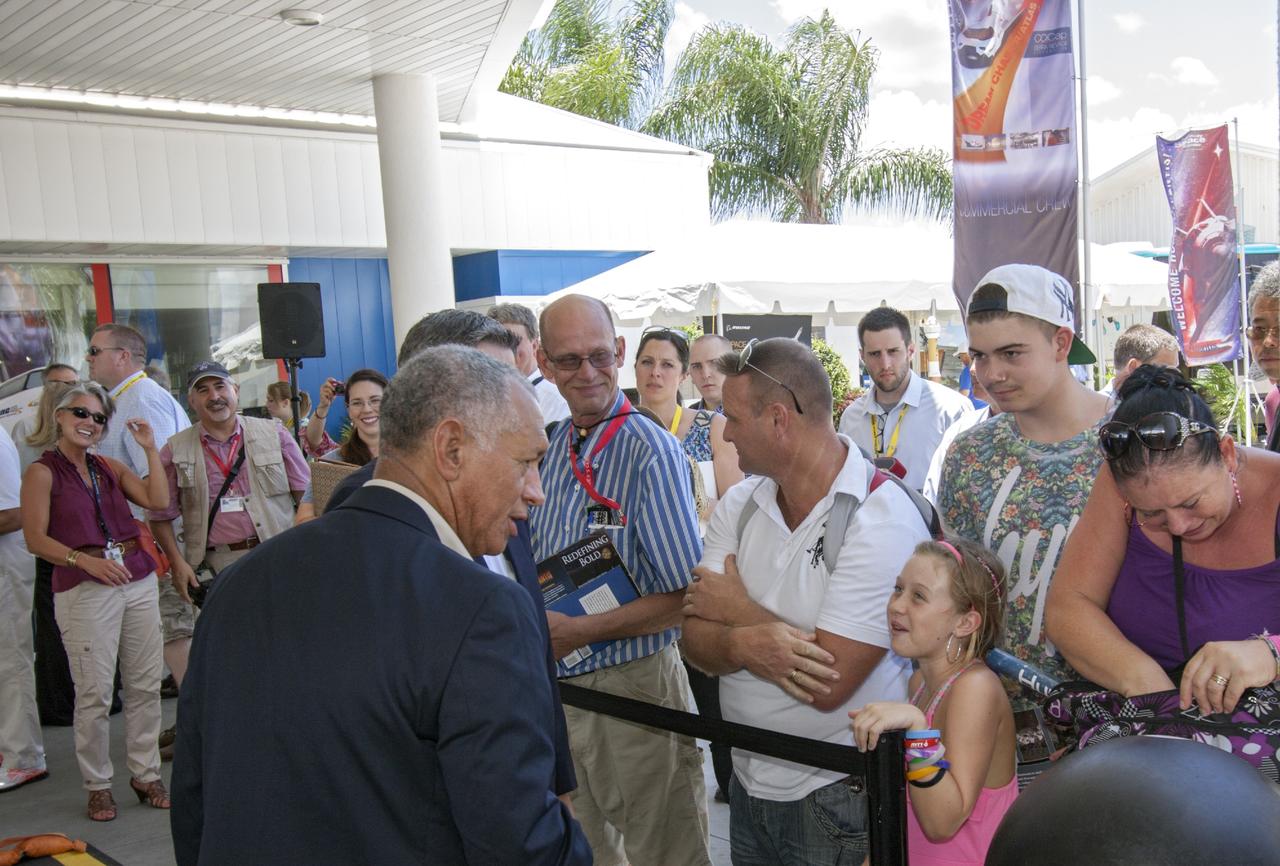 CAPE CANAVERAL, Fla. -- At the Kennedy Space Center Visitor Complex in Florida, Charlie Bolden, NASA administrator talks to guests prior to the opening of the 90,000-square-foot "Space Shuttle Atlantis" facility.      The new $100 million facility includes interactive exhibits that tell the story of the 30-year Space Shuttle Program and highlight the future of space exploration. The "Space Shuttle Atlantis" exhibit formally opened to the public on June 29, 2013.Photo credit: NASA/Jim Grossmann