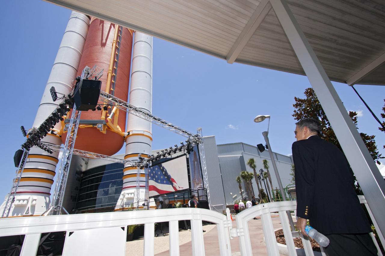 CAPE CANAVERAL, Fla. -- At the Kennedy Space Center Visitor Complex in Florida, center director Bob Cabana checks out the full-scale set of space shuttle twin solid rocket boosters and external fuel tank at the entrance to the 90,000-square-foot "Space Shuttle Atlantis" facility. Guests will be able to walk beneath the 184-foot-tall boosters and tank as they enter the facility.      The new $100 million facility includes interactive exhibits that tell the story of the 30-year Space Shuttle Program and highlight the future of space exploration. The "Space Shuttle Atlantis" exhibit formally opened to the public on June 29, 2013.Photo credit: NASA/Jim Grossmann
