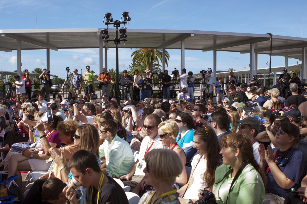CAPE CANAVERAL, Fla. -- At the Kennedy Space Center Visitor Complex in Florida, guests listen to presentations during opening ceremonies for the new 90,000-square-foot "Space Shuttle Atlantis" facility.      The new $100 million facility includes interactive exhibits that tell the story of the 30-year Space Shuttle Program and highlight the future of space exploration. The "Space Shuttle Atlantis" exhibit formally opened to the public on June 29, 2013.Photo credit: NASA/Jim Grossmann