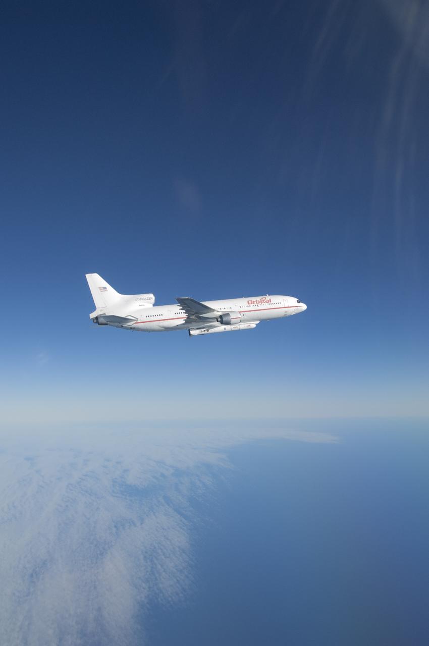 VANDENBERG AFB, Calif. – An Orbital Sciences L-1011 carrier aircraft flies over the Pacific Ocean off the California coast on a mission to launch NASA's IRIS spacecraft into low-Earth orbit. IRIS, short for Interface Region Imaging Spectrograph, was launched aboard an Orbital Sciences Pegasus XL rocket released from the bottom of the L-1011.Photo credit: NASA/Lori Losey