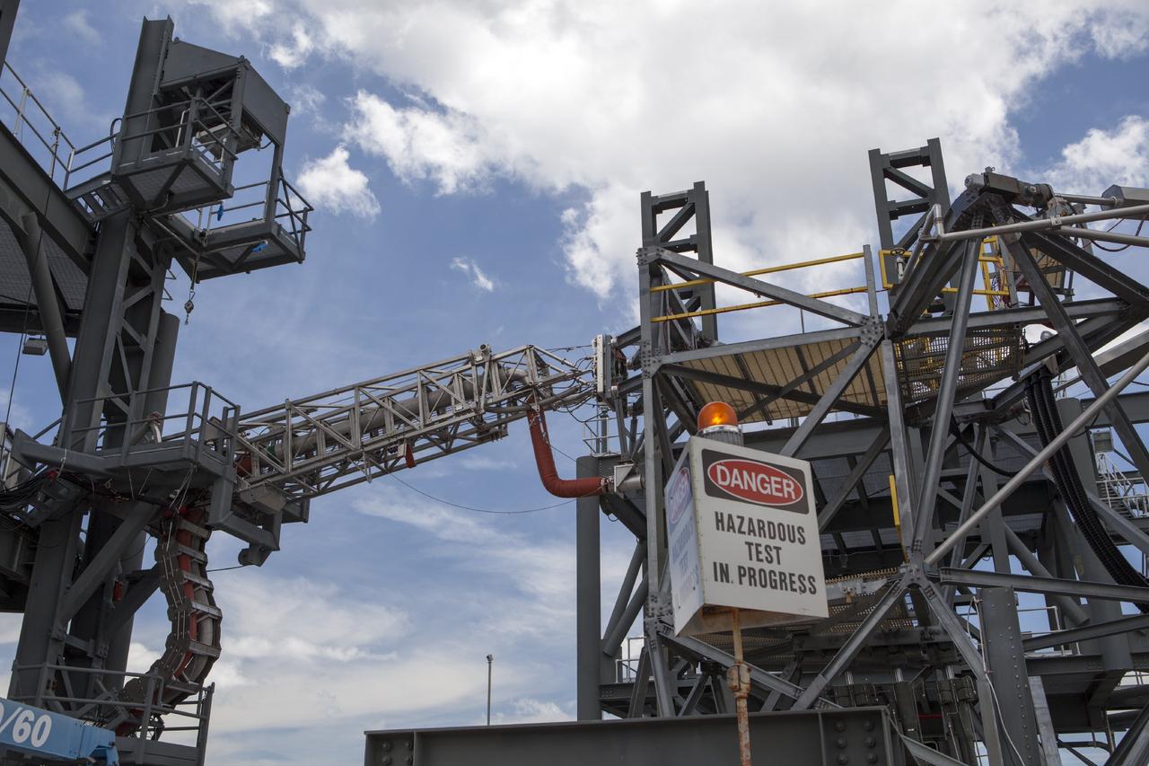 CAPE CANAVERAL, Fla. -- The quick disconnect for a modified instrument unit and liquid hydrogen tilt up umbilical is being tested at the Launch Equipment Test Facility by engineers in the Ground Systems Development and Operations Program at NASA’s Kennedy Space Center in Florida. The umbilical will be partially reutilized for the Orion Service Module Unit.    Orion is the exploration spacecraft designed to carry crews to space beyond low Earth orbit. It will provide emergency abort capability, sustain the crew during the space travel and provide safe re-entry from deep space return velocities. The first unpiloted test flight of the Orion is scheduled to launch in 2014 atop a Delta IV rocket and in 2017 on a Space Launch System rocket. For more information, visit http://www.nasa.gov/orion. Photo credit: NASA/Dimitri Gerondidakis