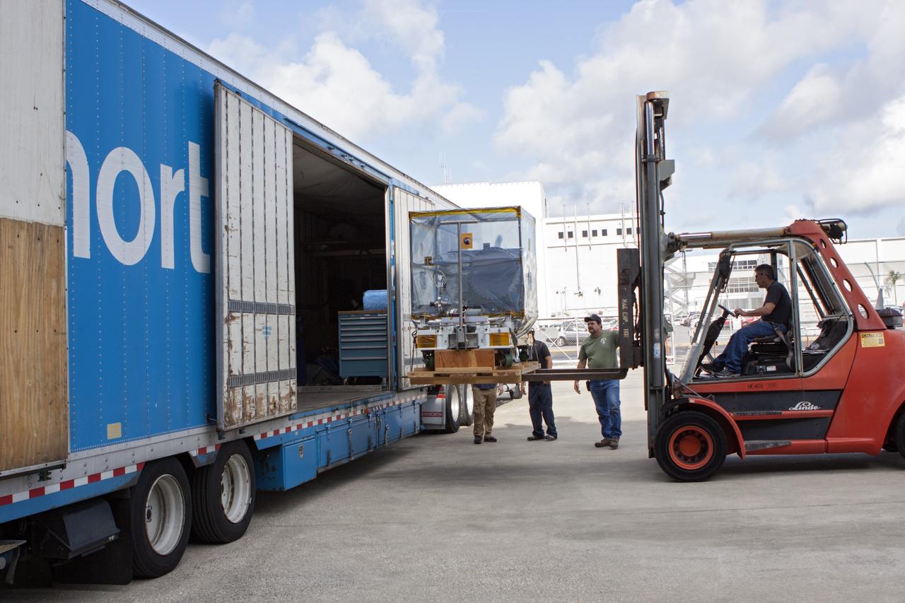 CAPE CANAVERAL, Fla. -- At NASA’s Kennedy Space Center in Florida, a technician uses a forklift to remove the Optical Payload for Lasercomm Science, or OPALS, experiment from a truck at the Space Station Processing Facility. The optical technology demonstration experiment arrived from the agency’s Jet Propulsion Laboratory in Pasadena, Calif. NASA will use the International Space Station to test OPALS’ communications technology that could dramatically improve spacecraft communications, enhance commercial missions and strengthen transmission of scientific data. The experiment is slated to fly later this year aboard a SpaceX Dragon commercial resupply mission to the space station. The mission is expected to run 90 days after installation on the outside of the station. For more information about OPALS, visit: http://go.nasa.gov/10MMPDO. Photo credit: NASA/Jim Grossmann
