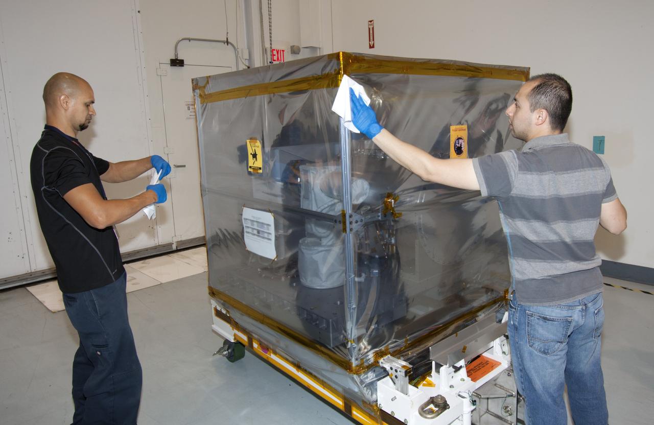 CAPE CANAVERAL, Fla. -- At NASA’s Kennedy Space Center in Florida, technicians prepare to move the Optical Payload for Lasercomm Science, or OPALS, experiment into the Space Station Processing Facility. The optical technology demonstration experiment arrived from the agency’s Jet Propulsion Laboratory in Pasadena, Calif. NASA will use the International Space Station to test OPALS’ communications technology that could dramatically improve spacecraft communications, enhance commercial missions and strengthen transmission of scientific data. The experiment is slated to fly later this year aboard a SpaceX Dragon commercial resupply mission to the space station. The mission is expected to run 90 days after installation on the outside of the station. For more information about OPALS, visit: http://go.nasa.gov/10MMPDO. Photo credit: NASA/Jim Grossmann