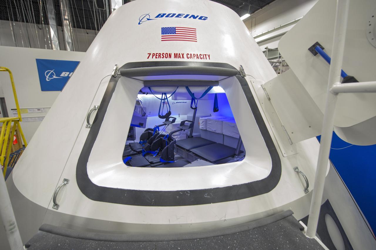 HOUSTON - The Boeing Company unveils its fully outfitted CST-100 mock-up at the company's Houston Product Support Center in Texas. This test version is optimized to support five crew members and will allow the company to evaluate crew safety, interfaces, communications, maneuverability and ergonomics. Boeing's CST-100 is being designed to transport crew members or a mix of crew and cargo to low-Earth-orbit destinations, including the International Space Station. Boeing is one of three aerospace industry partners working with CCP during its Commercial Crew Integrated Capability, or CCiCap, initiative, which is intended to make commercial human spaceflight services available for government and commercial customers. To learn more about CCP, visit http://www.nasa.gov/commercialcrew. Photo credit: NASA/Robert Markowitz