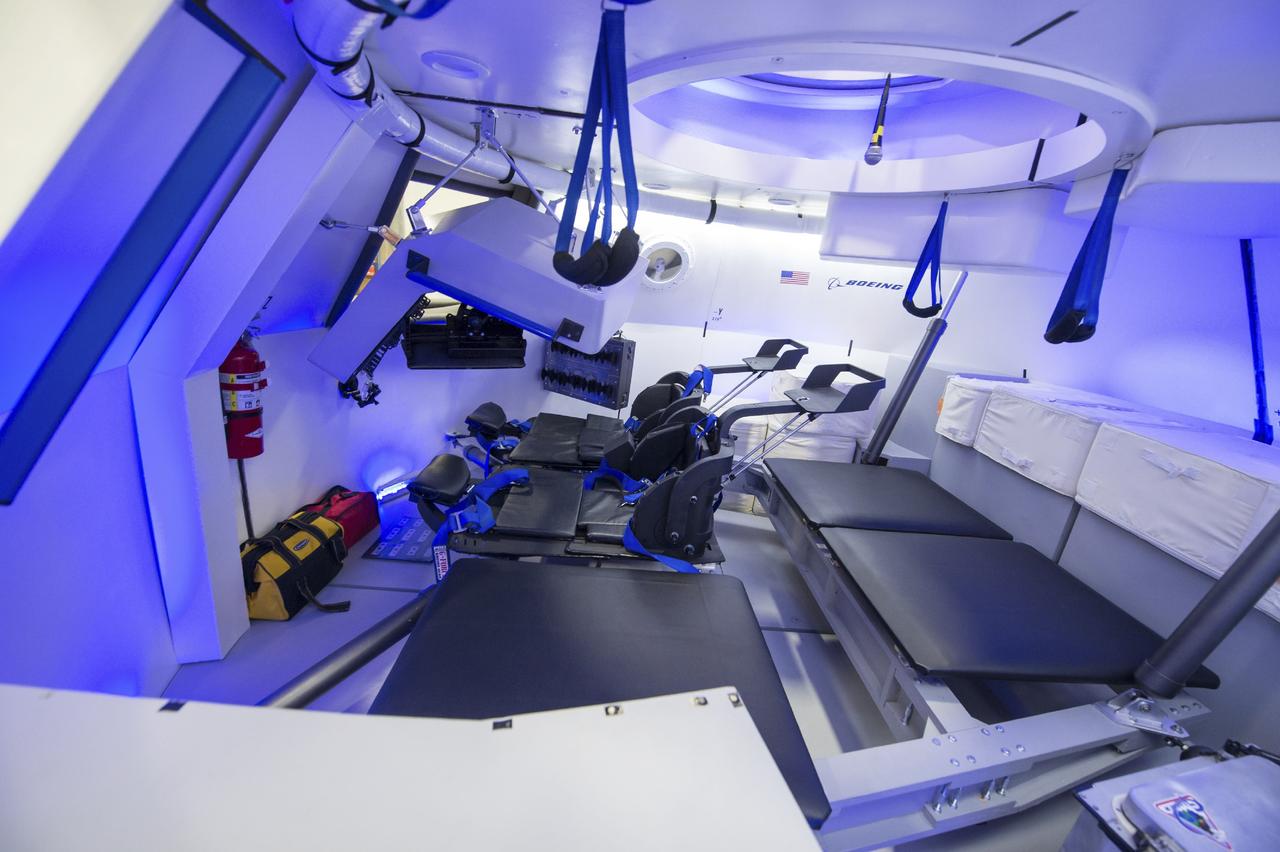 HOUSTON - JSC2013e068244 - The Boeing Company unveils the interior of its fully outfitted CST-100 mock-up at the company's Houston Product Support Center in Texas. This test version is optimized to support five crew members and will allow the company to evaluate crew safety, interfaces, communications, maneuverability and ergonomics. Boeing's CST-100 is being designed to transport crew members or a mix of crew and cargo to low-Earth-orbit destinations, including the International Space Station. Boeing is one of three aerospace industry partners working with CCP during its Commercial Crew Integrated Capability, or CCiCap, initiative, which is intended to make commercial human spaceflight services available for government and commercial customers. To learn more about CCP, visit http://www.nasa.gov/commercialcrew. Photo credit: NASA/Robert Markowitz