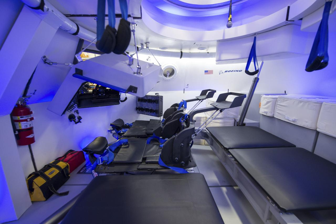 HOUSTON - JSC2013e068245 - The Boeing Company unveils the interior its fully outfitted CST-100 mock-up at the company's Houston Product Support Center in Texas. This test version is optimized to support five crew members and will allow the company to evaluate crew safety, interfaces, communications, maneuverability and ergonomics. Boeing's CST-100 is being designed to transport crew members or a mix of crew and cargo to low-Earth-orbit destinations, including the International Space Station. Boeing is one of three aerospace industry partners working with CCP during its Commercial Crew Integrated Capability, or CCiCap, initiative, which is intended to make commercial human spaceflight services available for government and commercial customers. To learn more about CCP, visit http://www.nasa.gov/commercialcrew. Photo credit: NASA/Robert Markowitz