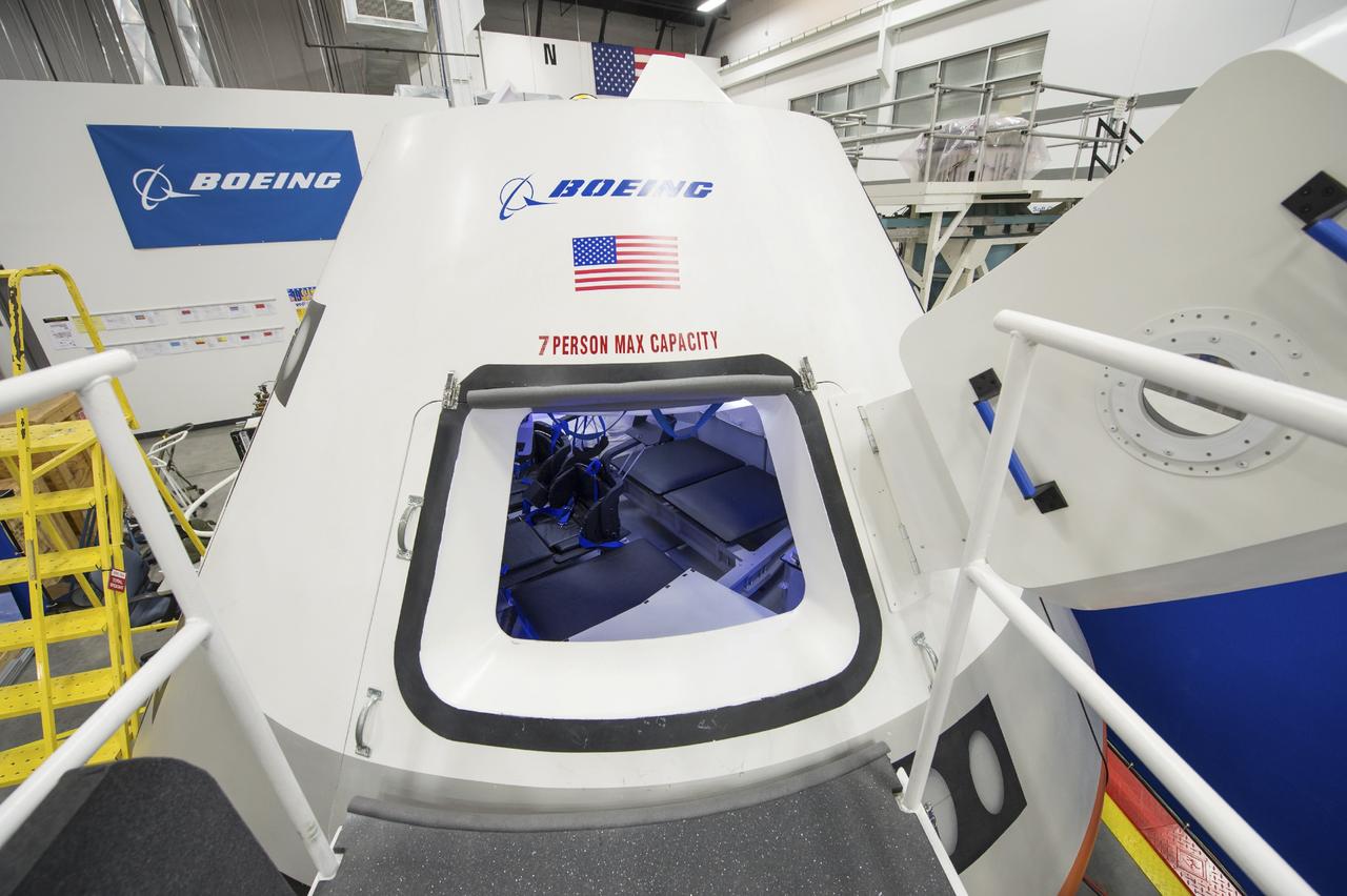 HOUSTON - JSC2013e068247 - The Boeing Company unveils its fully outfitted CST-100 mock-up at the company's Houston Product Support Center in Texas. This test version is optimized to support five crew members and will allow the company to evaluate crew safety, interfaces, communications, maneuverability and ergonomics. Boeing's CST-100 is designed being to transport crew members or a mix of crew and cargo to low-Earth-orbit destinations, including the International Space Station. Boeing is one of three aerospace industry partners working with CCP during its Commercial Crew Integrated Capability, or CCiCap, initiative, which is intended to make commercial human spaceflight services available for government and commercial customers. To learn more about CCP, visit www.nasa.gov/commercialcrew. Photo credit: NASA/Robert Markowitz