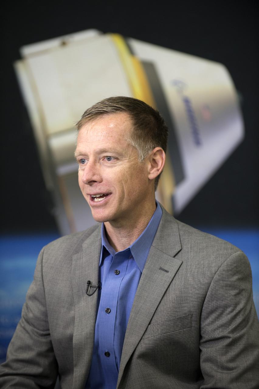 HOUSTON - Chris Ferguson, director of Crew and Mission Operations for The Boeing Company, is interviewed by the media during the unveiling of a CST-100 mock-up at the company's Houston Product Support Center. Boeing's CST-100 is being designed to transport crew members or a mix of crew and cargo to low-Earth-orbit destinations, including the International Space Station. Boeing is one of three aerospace industry partners working with NASA's Commercial Crew Program, or CCP, during its Commercial Crew Integrated Capability, or CCiCap, initiative, which is intended to make commercial human spaceflight services available for government and commercial customers. To learn more about CCP, visit http://www.nasa.gov/commercialcrew. Photo credit: NASA/Robert Markowitz