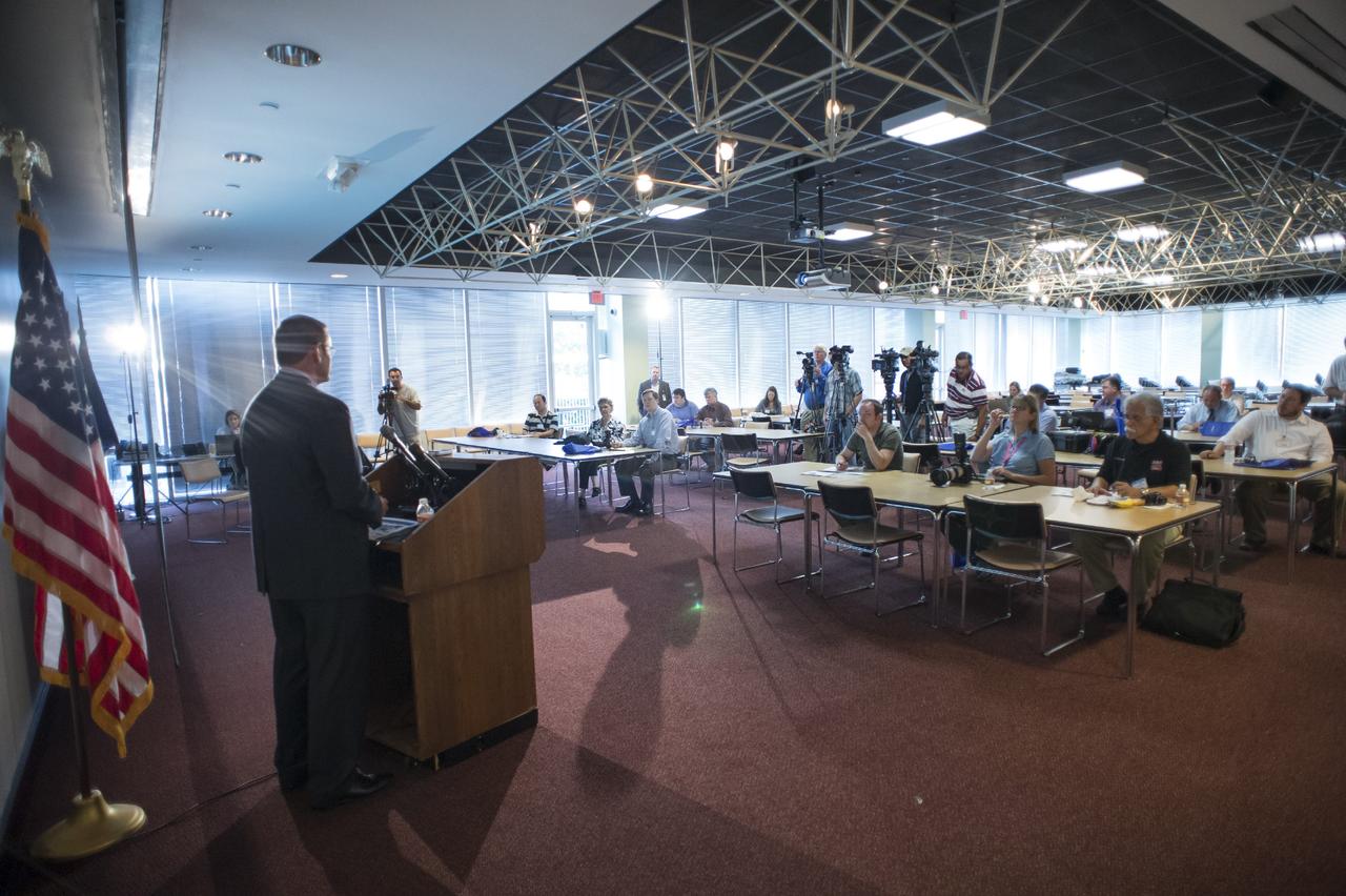HOUSTON - JSC2013e068287 - John Elbon, vice president for Space Exploration for The Boeing Company, addresses the media before the unveiling of a CST-100 mock-up at the company's Houston Product Support Center. This test version is optimized to support five crew members and will allow the company to evaluate crew safety, interfaces, communications, maneuverability and ergonomics. Boeing's CST-100 is being designed to transport crew members or a mix of crew and cargo to low-Earth-orbit destinations. The evaluation is part of the ongoing work supporting Boeing's funded Space Act Agreement with NASA's Commercial Crew Program, or CCP, during the agency's Commercial Crew Integrated Capability, or CCiCap, initiative. CCiCap is intended to make commercial human spaceflight services available for government and commercial customers. To learn more about CCP, visit http://www.nasa.gov/commercialcrew. Photo credit: NASA/Robert Markowitz