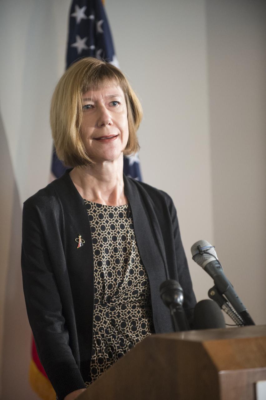 HOUSTON - JSC2013e068290 - Kathy Lueders, NASA deputy manager for the Commercial Crew Program, addresses the media before the unveiling of a CST-100 mock-up at the company's Houston Product Support Center. This test version is optimized to support five crew members and will allow the company to evaluate crew safety, interfaces, communications, maneuverability and ergonomics. Boeing's CST-100 is being designed to transport crew members or a mix of crew and cargo to low-Earth-orbit destinations. The evaluation is part of the ongoing work supporting Boeing's funded Space Act Agreement with NASA's Commercial Crew Program, or CCP, during the agency's Commercial Crew Integrated Capability, or CCiCap, initiative. CCiCap is intended to make commercial human spaceflight services available for government and commercial customers. To learn more about CCP, visit http://www.nasa.gov/commercialcrew. Photo credit: NASA/Robert Markowitz