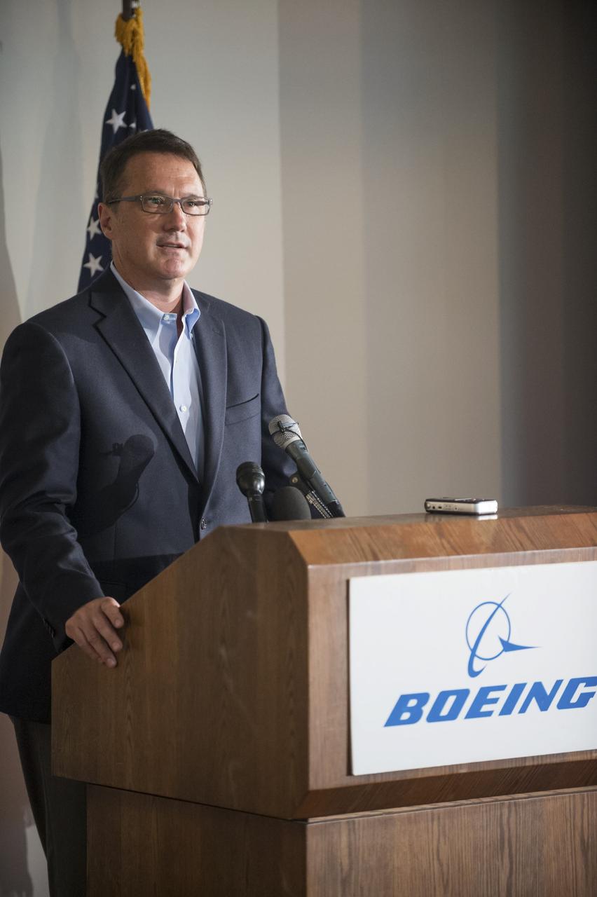 HOUSTON - JSC2013e068296 - John Mulholland, vice president and program manager, Commercial Crew, for The Boeing Company, addresses the media before the unveiling of a CST-100 mock-up at the company's Houston Product Support Center. This test version is optimized to support five crew members and will allow the company to evaluate crew safety, interfaces, communications, maneuverability and ergonomics. Boeing's CST-100 is being designed to transport crew members or a mix of crew and cargo to low-Earth-orbit destinations. The evaluation is part of the ongoing work supporting Boeing's funded Space Act Agreement with NASA's Commercial Crew Program, or CCP, during the agency's Commercial Crew Integrated Capability, or CCiCap, initiative. CCiCap is intended to make commercial human spaceflight services available for government and commercial customers. To learn more about CCP, visit http://www.nasa.gov/commercialcrew. Photo credit: NASA/Robert Markowitz