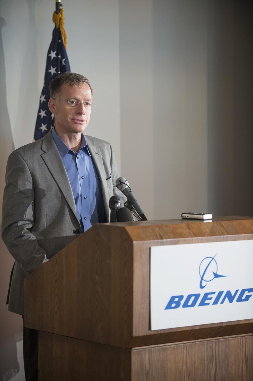 HOUSTON - JSC2013e068300 - Chris Ferguson, director of Crew and Mission Operations for The Boeing Company and former NASA astronaut, addresses the media before the unveiling of a CST-100 mock-up at the company's Houston Product Support Center. This test version is optimized to support five crew members and will allow the company to evaluate crew safety, interfaces, communications, maneuverability and ergonomics. Boeing's CST-100 is being designed to transport crew members or a mix of crew and cargo to low-Earth-orbit destinations. The evaluation is part of the ongoing work supporting Boeing's funded Space Act Agreement with NASA's Commercial Crew Program, or CCP, during the agency's Commercial Crew Integrated Capability, or CCiCap, initiative. CCiCap is intended to make commercial human spaceflight services available for government and commercial customers. To learn more about CCP, visit http://www.nasa.gov/commercialcrew. Photo credit: NASA/Robert Markowitz