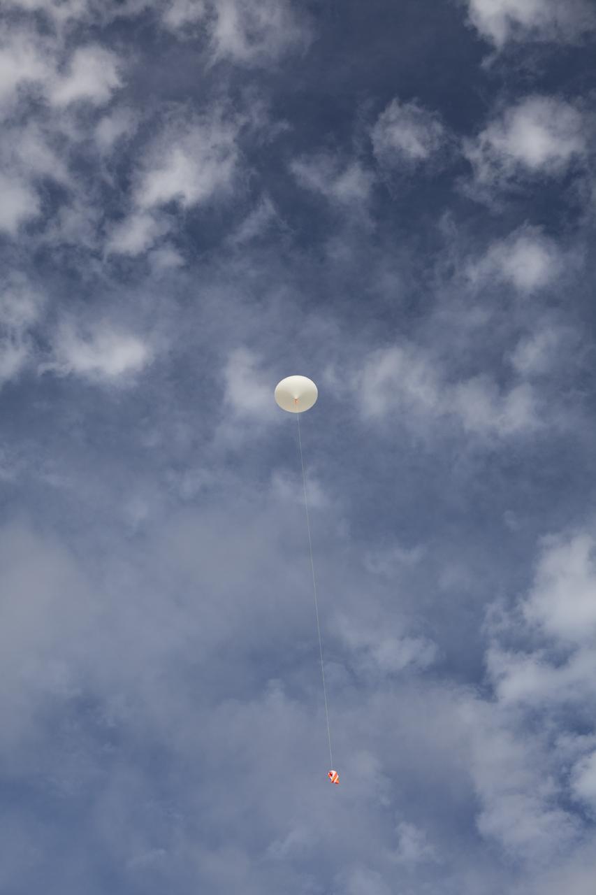 CAPE CANAVERAL, Fla. – Rocket University participants release a high-altitude balloon to carry an instrument package as part of an aerial experiment by the program. The balloon was released at Kennedy Space Center and its instrument package was recovered to the southeast as planned. Photo credit: NASA/Dmitri Gerondidakis