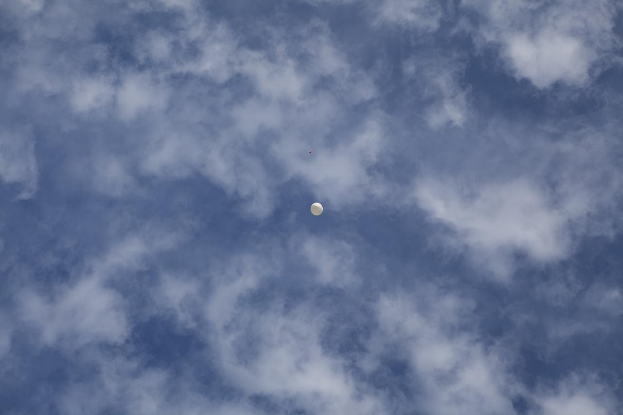 CAPE CANAVERAL, Fla. – A high-altitude balloon floats into the sky carrying an instrument package as part of an aerial experiment by the Rocket University program. The balloon was released at Kennedy Space Center and its instrument package was recovered to the southeast as planned. Photo credit: NASA/Dmitri Gerondidakis