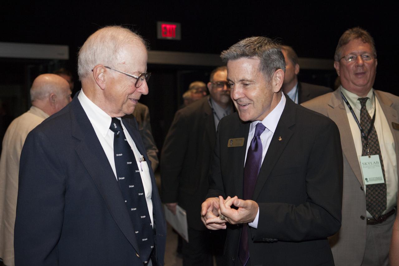 CAPE CANAVERAL, Fla. – At the Kennedy Space Center's Apollo/Saturn V Center Bob Cabana, Kennedy's director, right, speaks with Skylab 2 pilot Paul Weitz during an event sponsored by the Astronaut Scholarship Foundation celebrating the 40th anniversary of Skylab. Both astronauts also flew missions during the Space Shuttle Program.      The gala commemorating the 40th anniversary of Skylab included six of the nine astronauts who flew missions to America's first space station. The orbiting laboratory was launched unpiloted from Kennedy on May 14, 1973. Between May 25, 1973 and Feb. 8, 1974, crews of three spent 28, 59 and 84 days living and working in low-Earth orbit aboard the station. For more information, visit http://www.nasa.gov/mission_pages/skylab/ Photo credit: NASA/Kim Shiflett