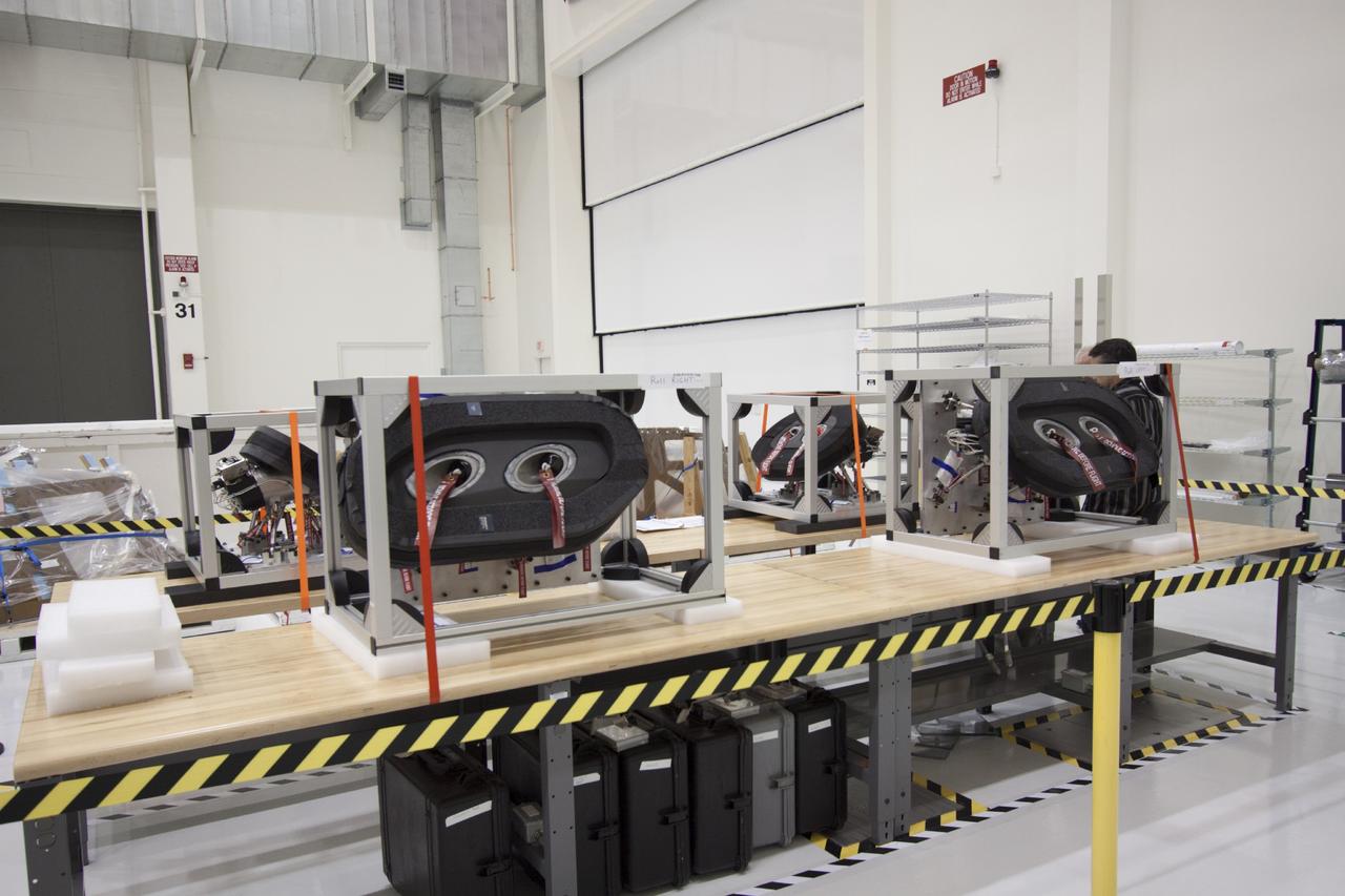 CAPE CANAVERAL, Fla. – Inside the Operations and Checkout Building high bay at NASA’s Kennedy Space Center in Florida, several of the reaction control system roll and yaw thrusters for the Orion crew module have been unpacked and placed on stands for processing.      Orion is the exploration spacecraft designed to carry crews to space beyond low Earth orbit. It will provide emergency abort capability, sustain the crew during the space travel and provide safe re-entry from deep space return velocities. The first unpiloted test flight of the Orion is scheduled to launch in 2014 atop a Delta IV rocket and in 2017 on a Space Launch System rocket. For more information, visit http://www.nasa.gov/orion. Photo credit: NASA/Jim Grossmann