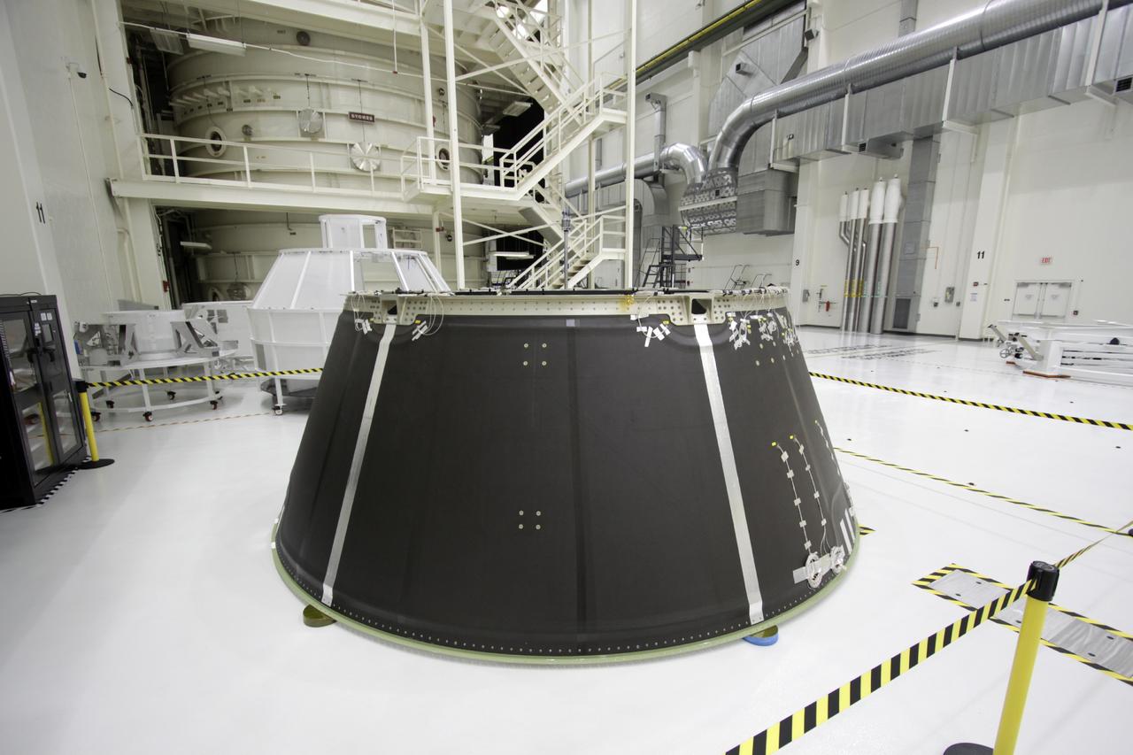 CAPE CANAVERAL, Fla. – Inside the Operations and Checkout Building high bay at NASA’s Kennedy Space Center in Florida, the Orion service module spacecraft adapter cone for Exploration Flight Test 1 has arrived for checkout and processing.      Orion is the exploration spacecraft designed to carry crews to space beyond low Earth orbit. It will provide emergency abort capability, sustain the crew during the space travel and provide safe re-entry from deep space return velocities. The first unpiloted test flight of the Orion is scheduled to launch in 2014 atop a Delta IV rocket and in 2017 on a Space Launch System rocket. For more information, visit http://www.nasa.gov/orion. Photo credit: NASA/Jim Grossmann