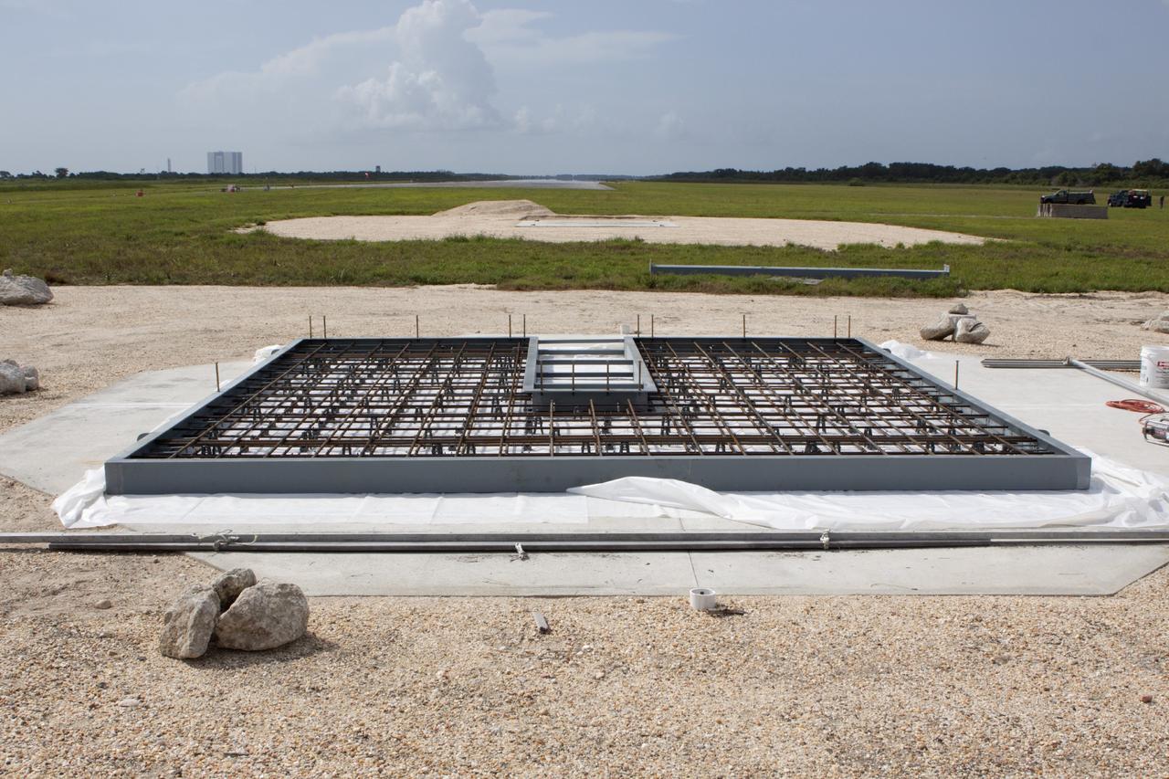 CAPE CANAVERAL, Fla. – At NASA’s Kennedy Space Center in Florida, buildup continues on a movable launch platform for the Project Morpheus lander at the north end of the Shuttle Landing Facility, or SLF. Testing of the prototype lander has been ongoing at NASA’s Johnson Space Center in Houston in preparation for free flight. The SLF will provide the lander with the kind of field necessary for realistic testing, complete with rocks, craters and hazards to avoid. Morpheus utilizes an autonomous landing and hazard avoidance technology, or ALHAT, payload that will allow it to navigate to clear landing sites amidst rocks, craters and other hazards during its descent. Project Morpheus is one of 20 small projects comprising the Advanced Exploration Systems, or AES, program in NASA’s Human Exploration and Operations Mission Directorate. AES projects pioneer new approaches for rapidly developing prototype systems, demonstrating key capabilities and validating operational concepts for future human missions beyond Earth orbit. For more information on Project Morpheus, visit http://www.nasa.gov/centers/johnson/exploration/morpheus/index.html. Photo credit: NASA/Jim Grossmann