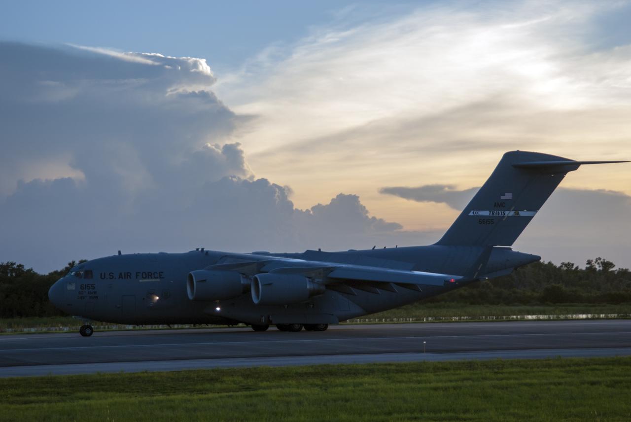 CAPE CANAVERAL, Fla. – A C-17 aircraft arrives at the Shuttle Landing Facility at NASA's Kennedy Space Center in Florida carrying the MAVEN spacecraft for processing ahead of a launch later this year on a United Launch Alliance Atlas V rocket. MAVEN, short for Mars Atmosphere and Volatile Evolution, will orbit Mars to study the Red Planet's upper atmosphere in unprecedented detail. Photo credit: NASA/Tim Jacobs