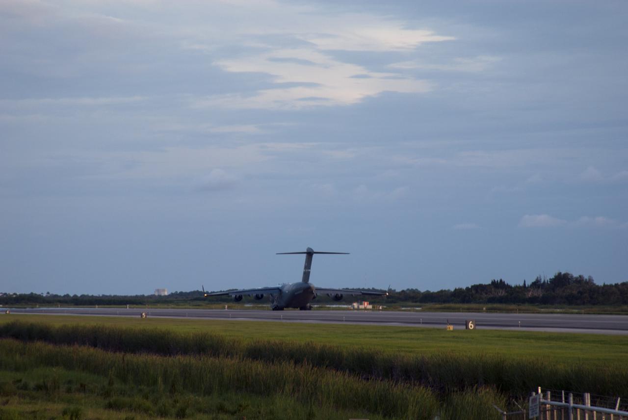 CAPE CANAVERAL, Fla. – A C-17 aircraft rolls to a stop on the Shuttle Landing Facility at NASA's Kennedy Space Center in Florida. The aircraft is delivering the MAVEN spacecraft for processing ahead of a launch later this year on a United Launch Alliance Atlas V rocket. MAVEN, short for Mars Atmosphere and Volatile Evolution, will orbit Mars to study the Red Planet's upper atmosphere in unprecedented detail. Photo credit: NASA/Tim Jacobs