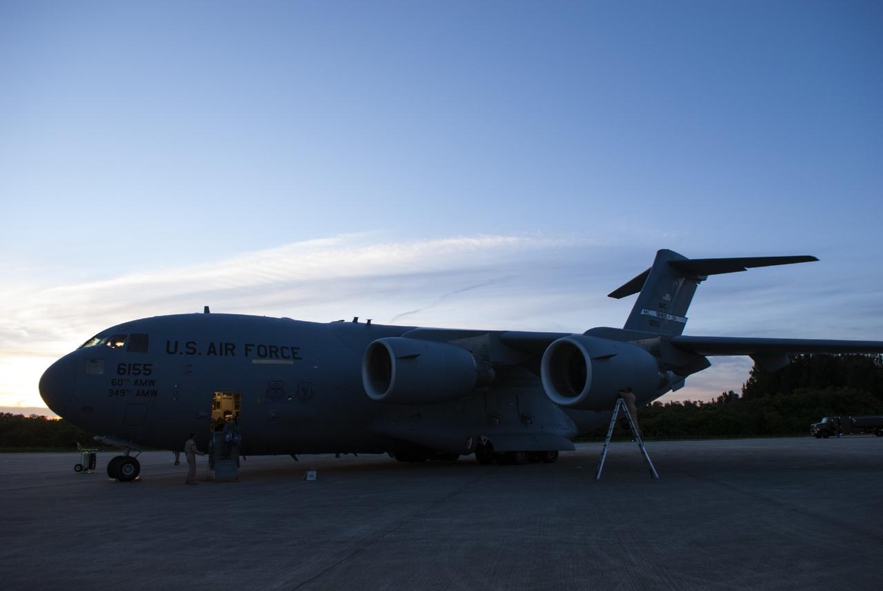 CAPE CANAVERAL, Fla. – A C-17 aircraft arrives on the Shuttle Landing Facility parking apron at NASA's Kennedy Space Center in Florida. The aircraft is delivering the MAVEN spacecraft for processing ahead of a launch later this year on a United Launch Alliance Atlas V rocket. MAVEN, short for Mars Atmosphere and Volatile Evolution, will orbit Mars to study the Red Planet's upper atmosphere in unprecedented detail. Photo credit: NASA/Tim Jacobs